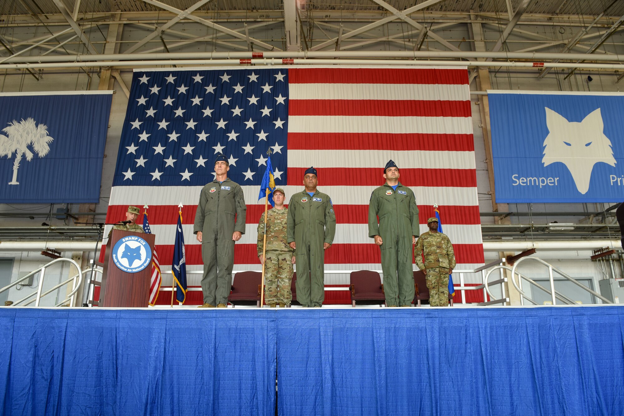 The South Carolina Air National Guard’s 169th Fighter Wing conducts a change of command ceremony at McEntire Joint National Guard Base, South Carolina, Sept. 11, 2021, where U.S. Air Force Col. Quaid Quadri Jr., right, assumes command from Col. Akshai Gandhi., center. Brig. Gen. Boris Armstrong, Chief of Staff, South Carolina Air National Guard, left, presides over the ceremony. (U.S. Air National Guard photo by Tech Sgt. Megan Floyd, 169th Fighter Wing Public Affairs)