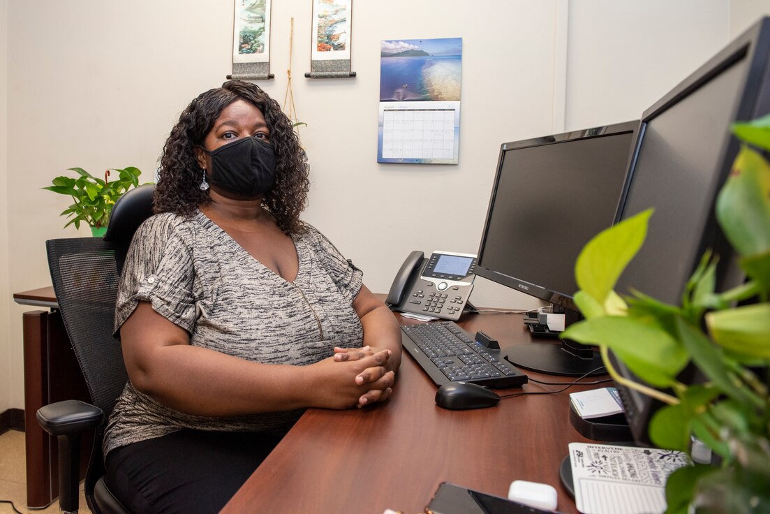 L. Diane Heard, 51st Munitions Squadron, violence prevention integrator, sits at her desk at Osan Air Base, Republic of Korea, September 2, 2021. As both a violence prevention integrator and a suicide prevention program manager, Heard provides assistance to struggling Airmen in the form of face to face counseling as well as virtual chat programs and video calls. (U.S. Air Force photo by Staff Sgt. Douglas Lorance)