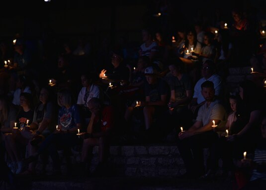 Members of the San Angelo community lit candles for a moment of silence during the 9/11 Remembrance Ceremony at the Bill Aylor Sr. Memorial RiverStage in San Angelo, Texas on Sept. 11, 2021. The ceremony included several speakers, a candlelit moment of silence, a video presentation, and a performance by the McGill Elementary children’s choir. (U.S. Air Force photo by Senior Airman Ashley Thrash)