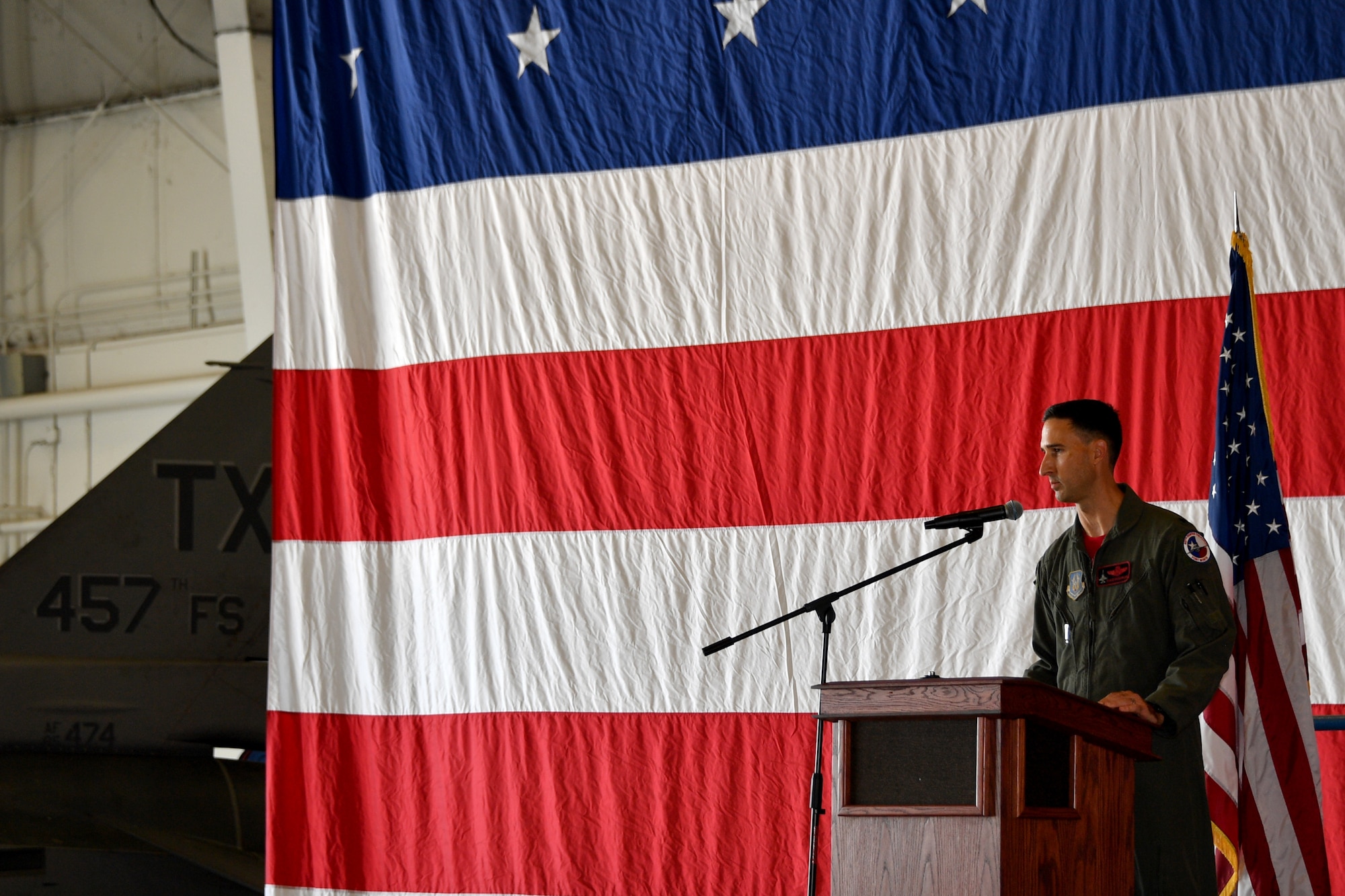 Lt. Col. David “Shave” Snodgrass, 457th Fighter Squadron commander, addresses his squadron during the 457 FS change of Command ceremony September 12, 2021, at U.S. Naval Air Station Joint Reserve Base Fort Worth, Texas. Snodgrass thanked his co-workers, friends, and family for their support of his military career. (U.S. Air Force photo by Staff Sgt. Randall Moose)