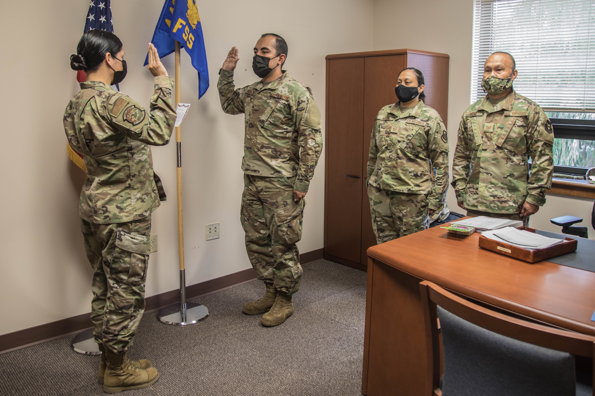 Airman raised his right hand to take the oath of enlistment.