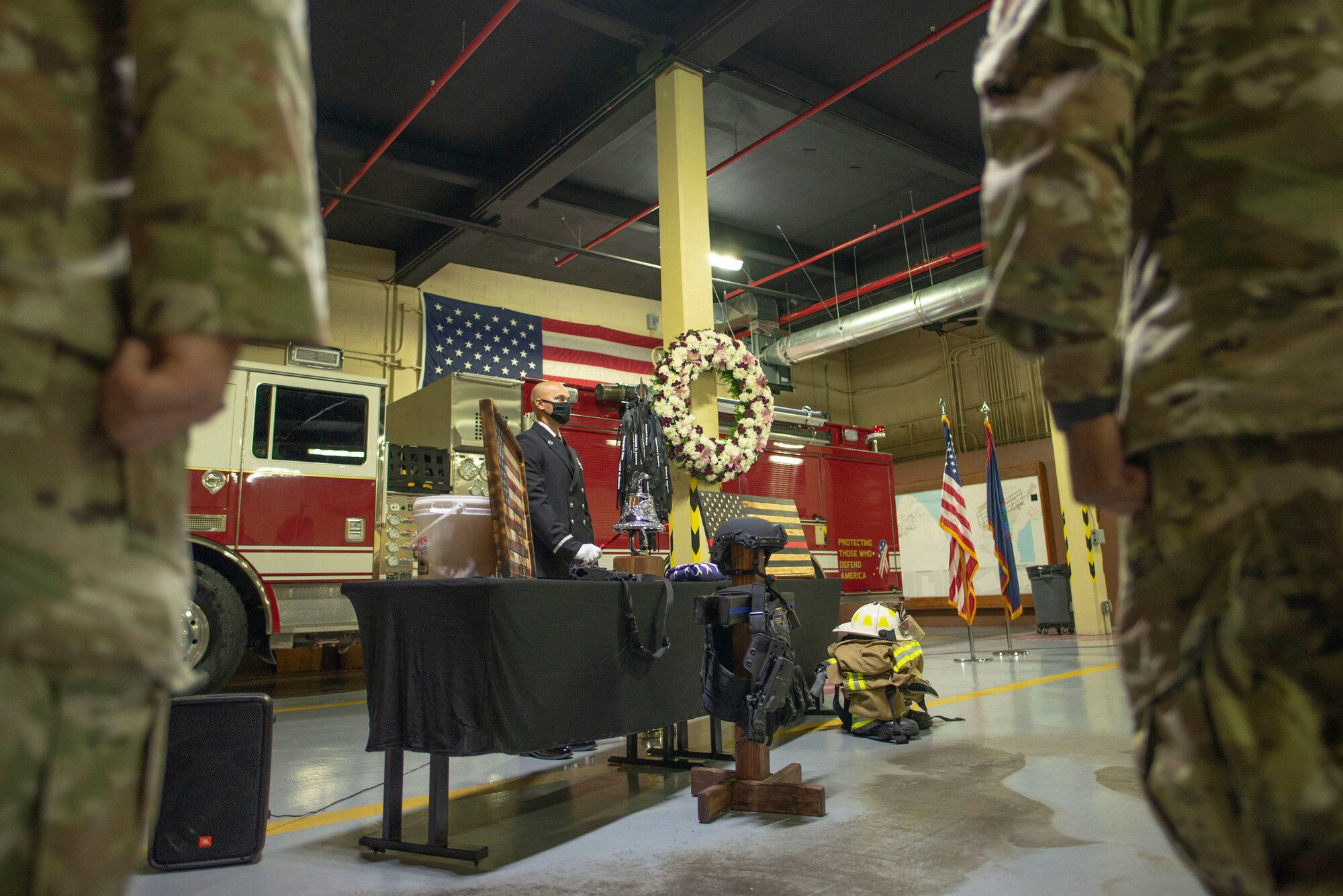 A firefighter rings a bell.