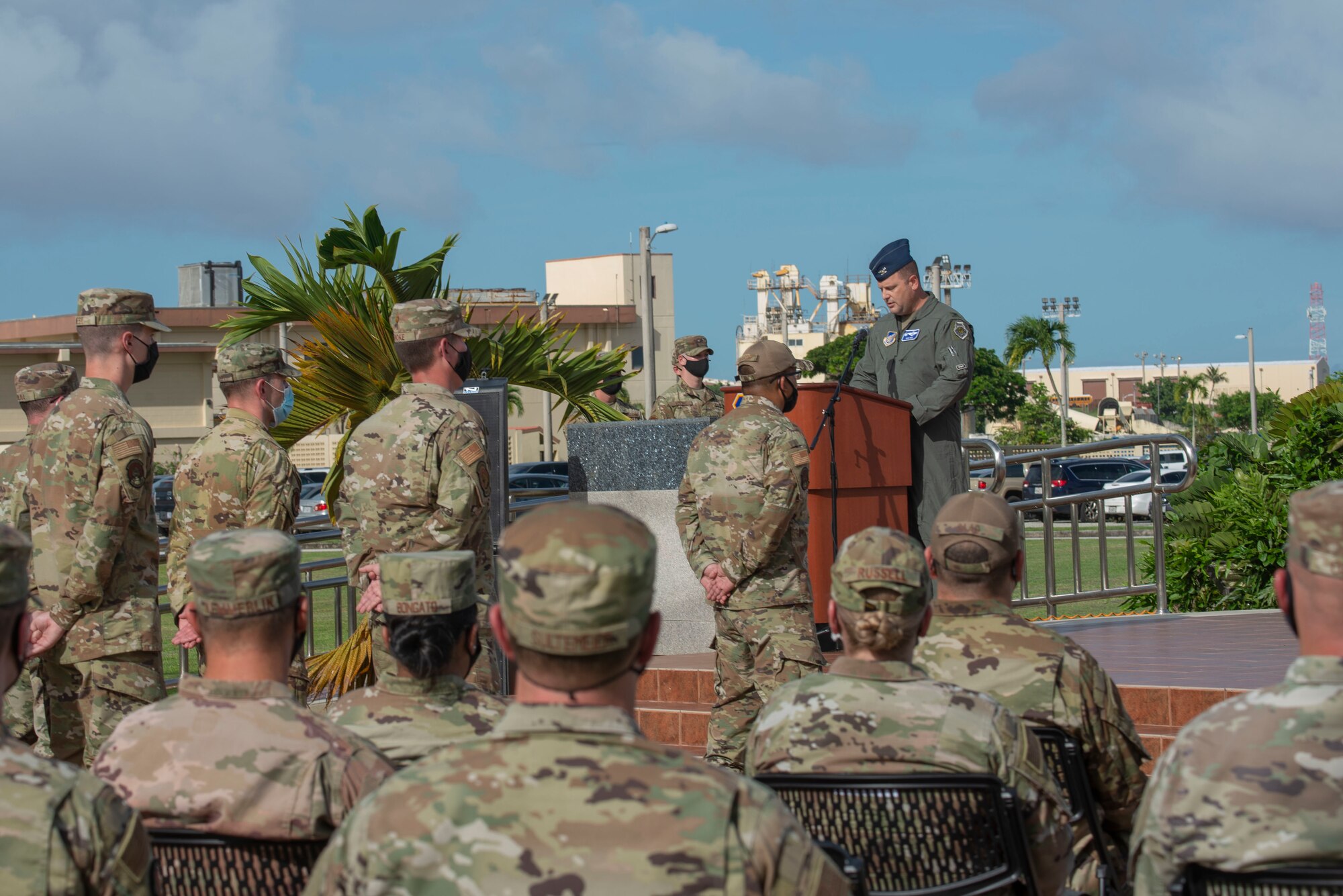 A man at a podium speaking  to a crowd.