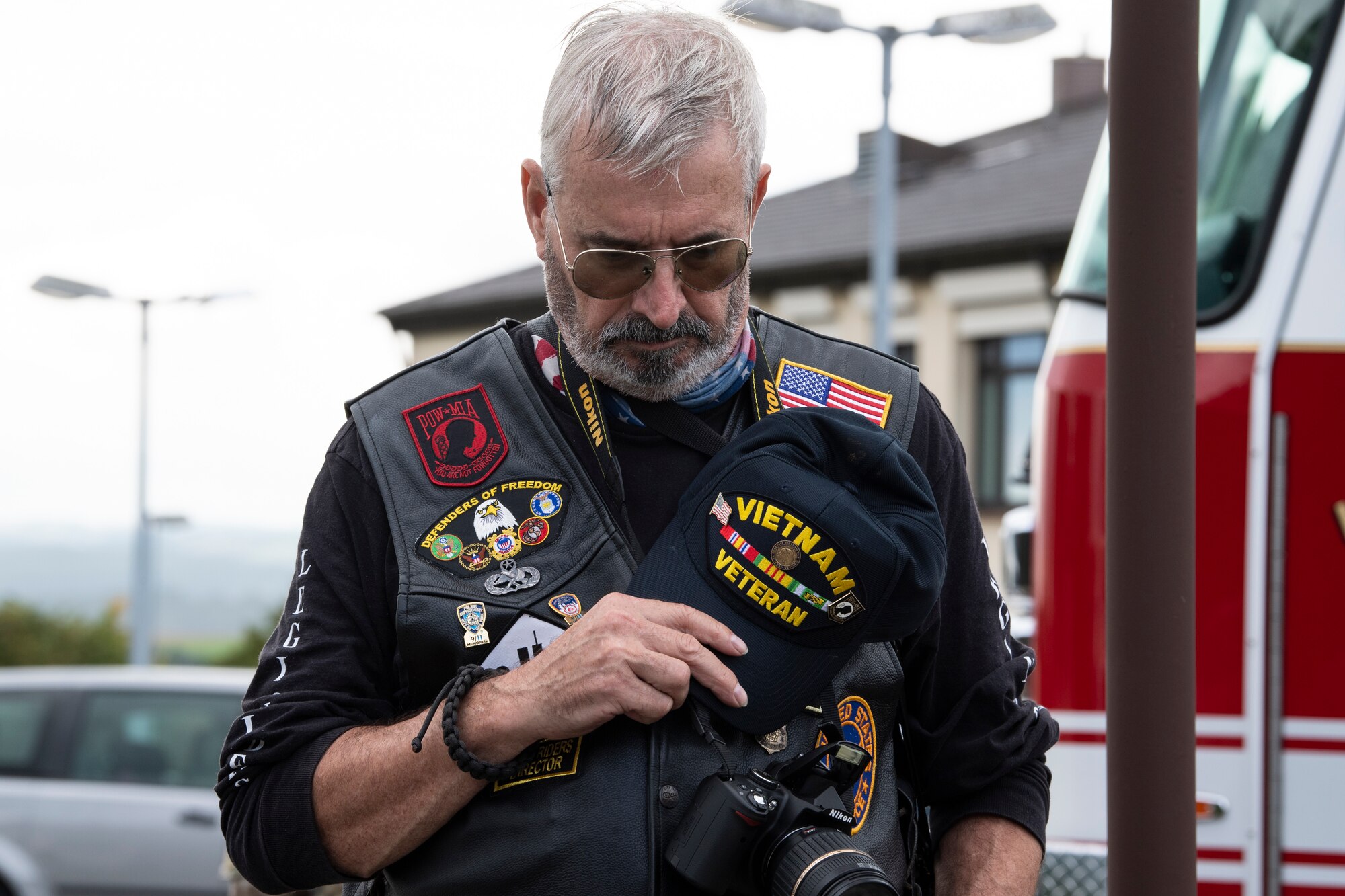 A veteran places his hat over his heart during a 9/11 Remembrance Ceremony hosted at the 52nd Fighter Wing Sept. 10, 2021, on Spangdahlem Air Base, Germany. The ceremony consisted of prayers from first responders, a ringing of a bell signifying the passing of first responders, wreath laying and speeches from 52nd FW and host nation leaders. (U.S. Air Force photo by Staff Sgt. Melody W. Howley)