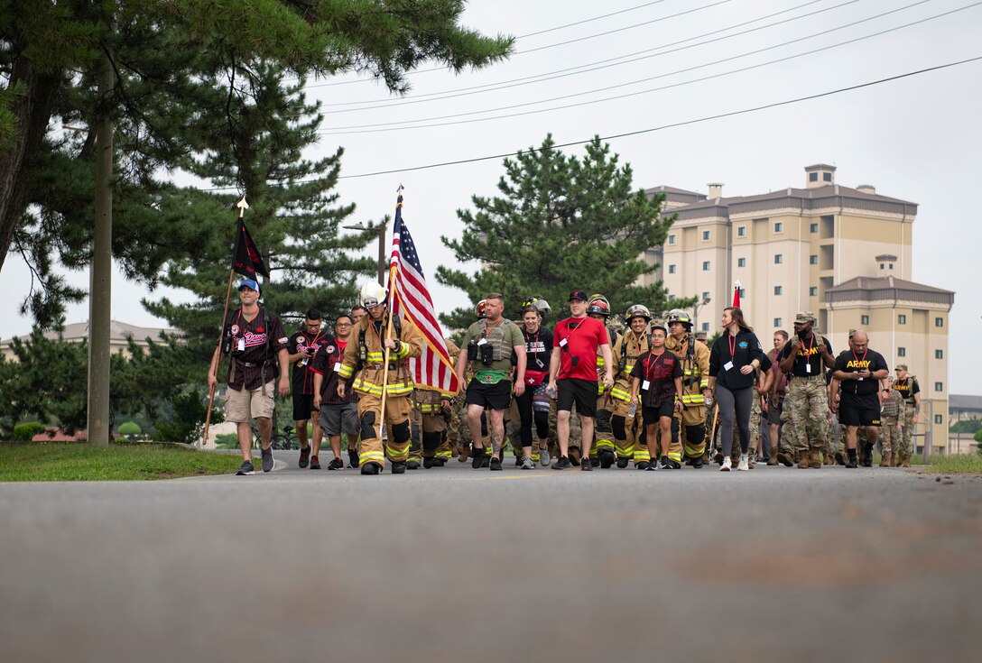 Airmen participate in a ruck march.