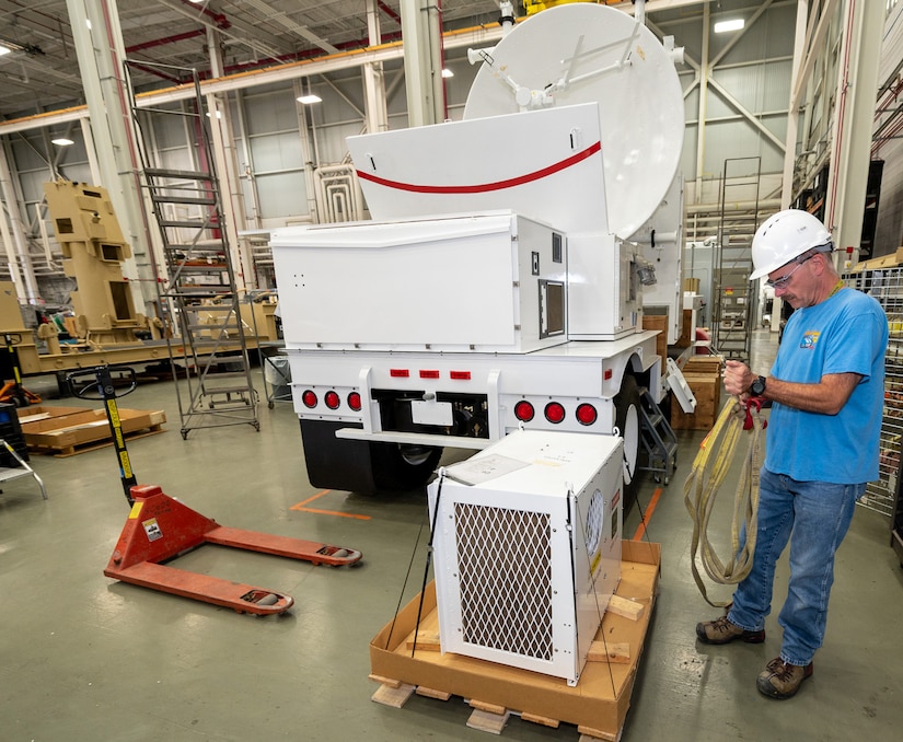 Photo of  Chris Katchmar installing an environmental control unit