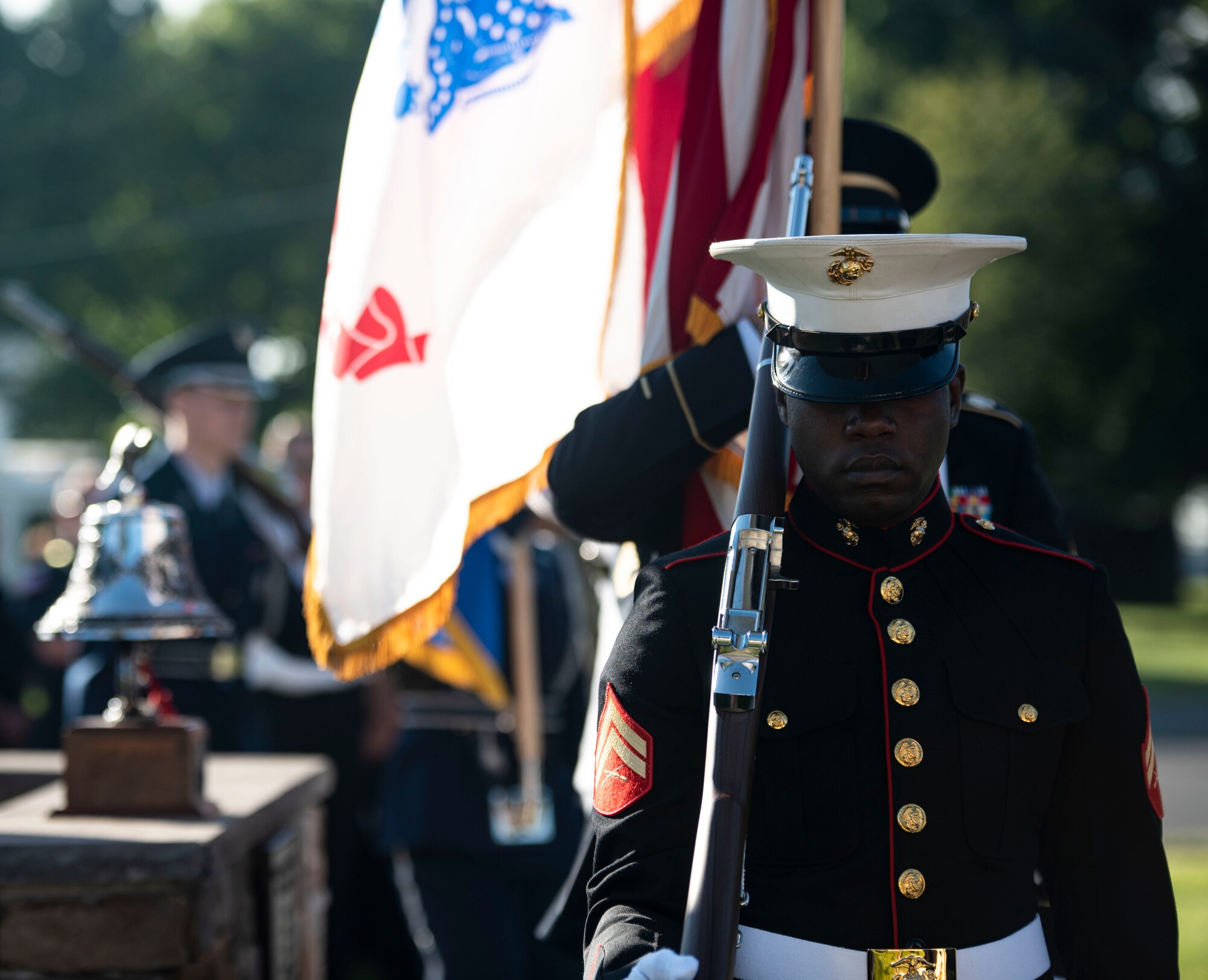 Members of the Joint Base Honor Guard prepare to present colors during the 9/11 20th Anniversary ceremony at Joint Base McGuire-Dix-Lakehurst, N.J. Sept. 9, 2021. The event was held to honor the 20th anniversary of 9/11 where 2,977 victims lost their lives and more than 6,000 were left injured. (U.S. Air Force Photo by Airman 1st Class Matthew Porter)