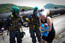 Belle, West Virginia (August 28, 2021) – U.S. Marines from The Chemical Biological Incident Response Force practice decontamination measures during a notional response to an emergency involving train colliding with a bus in Belle, West Virginia. Vigilant Guard is an annual large-scale disaster response exercise sponsored by the U.S. Northern Command in conjunction with the National Guard Bureau that brings federal, state, and local military personnel, public safety, first responders, and private sector partners together. The multi-day, hands-on and stimulated training exercise supports the development, enhancement, and interoperability of disaster response assets within a joint environment. (U.S. Marine Corps Photo by Staff Sgt. Kristian S. Karsten/Not Released)
