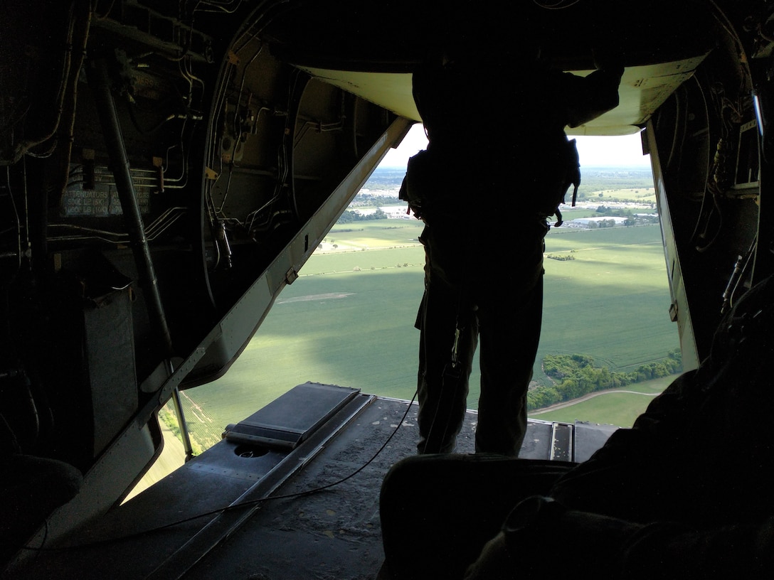 U.S. Marine Staff Sgt. Brian D Mays, a crew chief with VMM-261, assists in the air lift of Marines to support Task Force 51 in Ft. Polk in support of Defense Support for Civil Authorities (DSCA) operations with FEMA. NAS Chambers Field, Norfolk Va. (Released/U.S. Marine Corps photo by 1st Lt. Aaron Ladd)