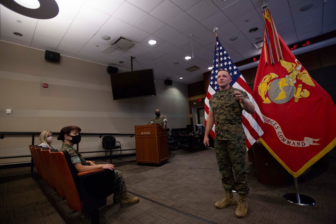 U.S. Marine Corps Sgt. Maj. Bradley S. Driver, Marine Corps Forces Command (MARFORCOM) Marine Corps Northern Command (MARFORNORTH), Fleet Marine Forces Atlantic (FMFLANT), Headquarters and Service Battalion (HQSVCBN) Sergeant Major, expresses his gratitude while sharing memories during the MARFORCOM, MARFORNORTH, FMFLANT, HQSVCBN, relief and appointment ceremony at Norfolk, Virginia, September 3, 2021. Sgt. Maj. Driver relinquishes his duties to Sgt. Maj. John S. Studer. (U.S. Marine Corps photo by Lance Cpl. Jack Chen)