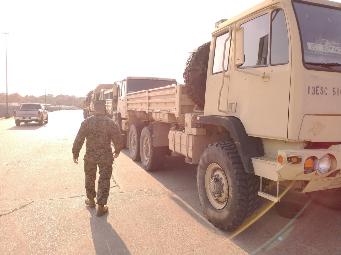 U.S. Marine Brig. Gen. Kelliher, officer in charge of the forward coordination element, examines various tactical support vehicles with the 61st Quartermaster Battalion, part of Task Force 51 Title 10 forces. (Released/U.S. Marine Corps photo by 1st Lt. Aaron Ladd)