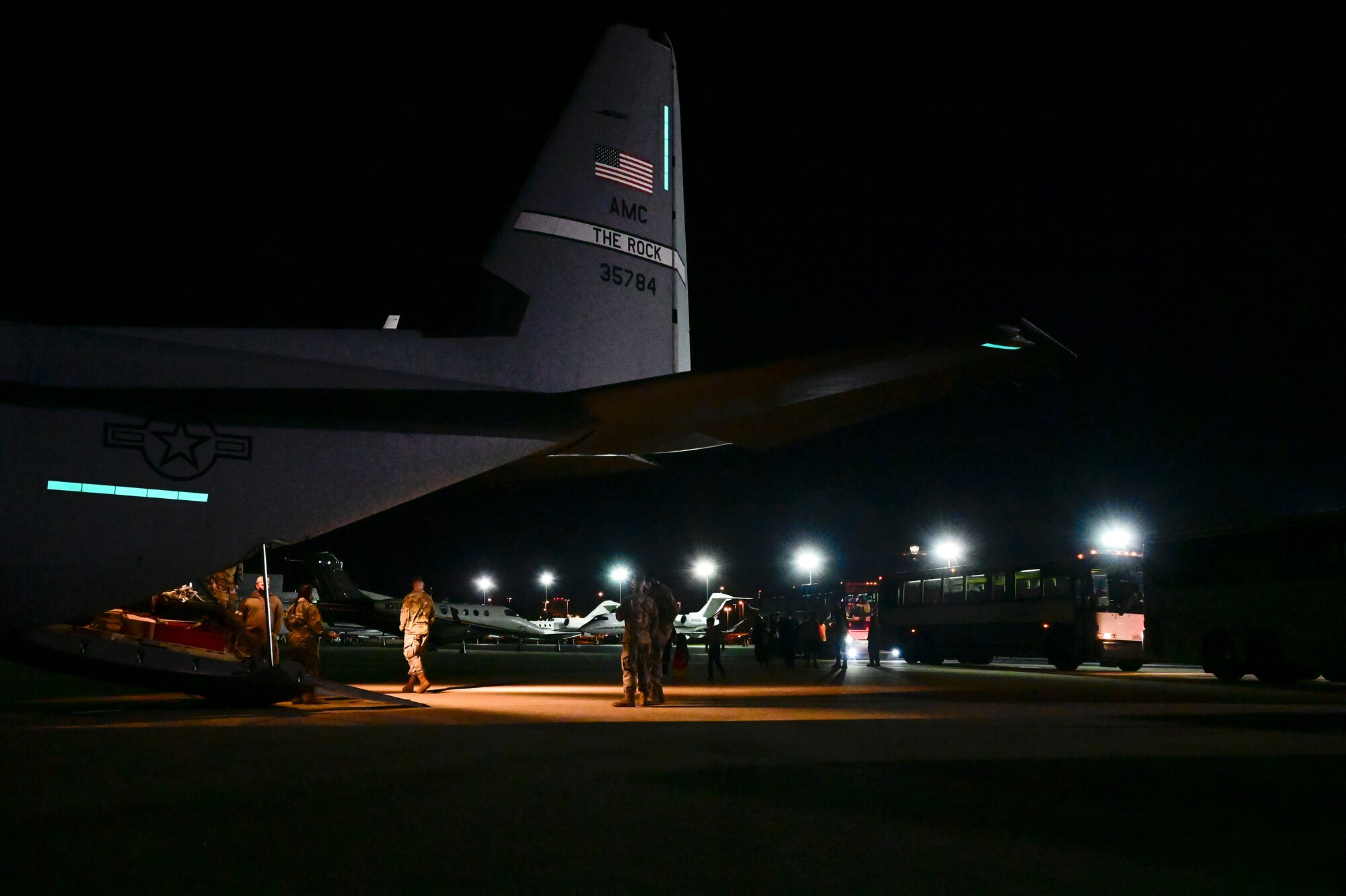 Afghan evacuees board a C-130J