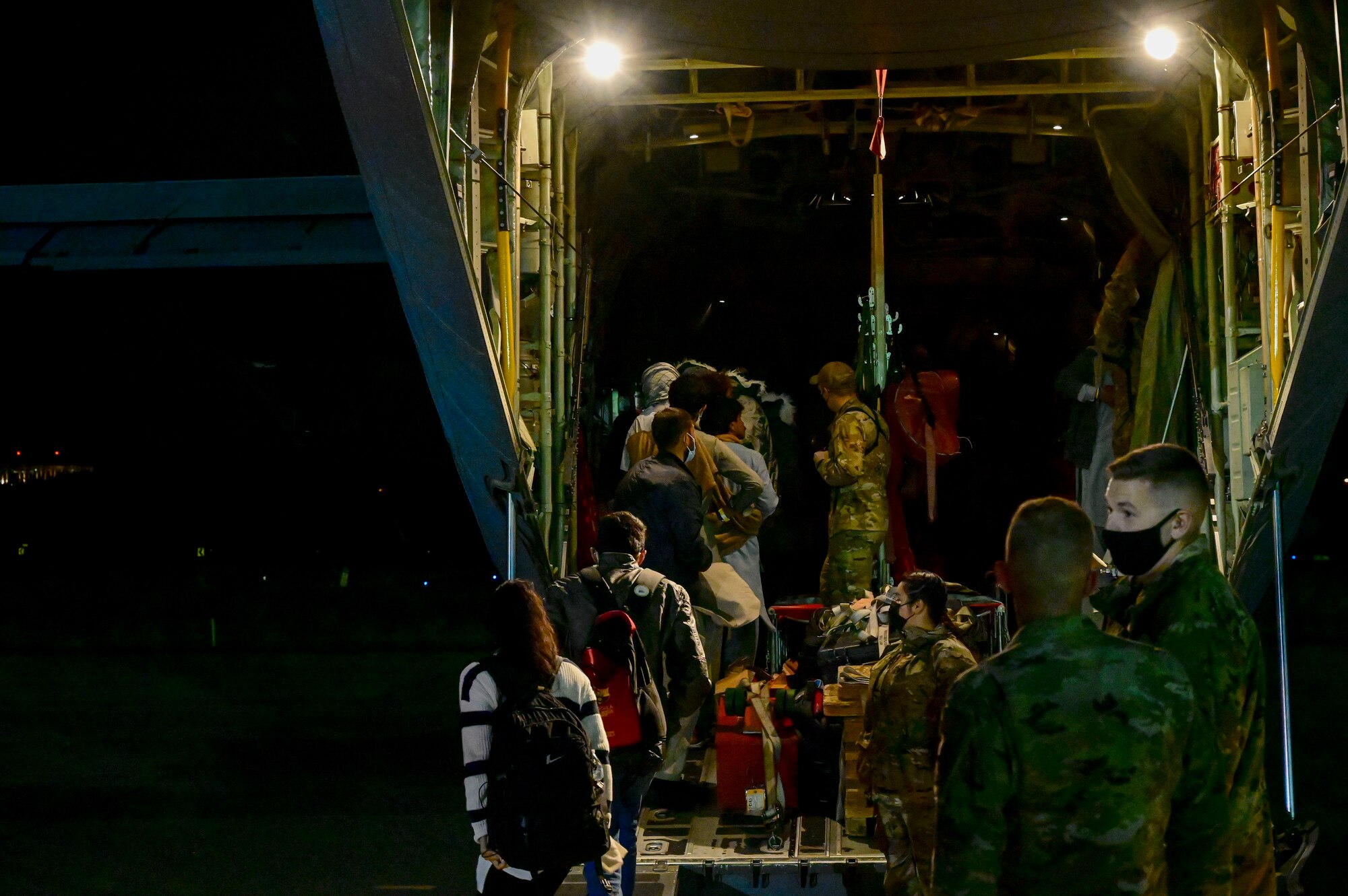 Afghan evacuees board C-130J