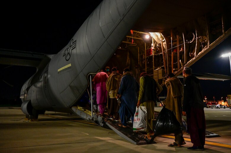 Afghan evacuees board a C-130J