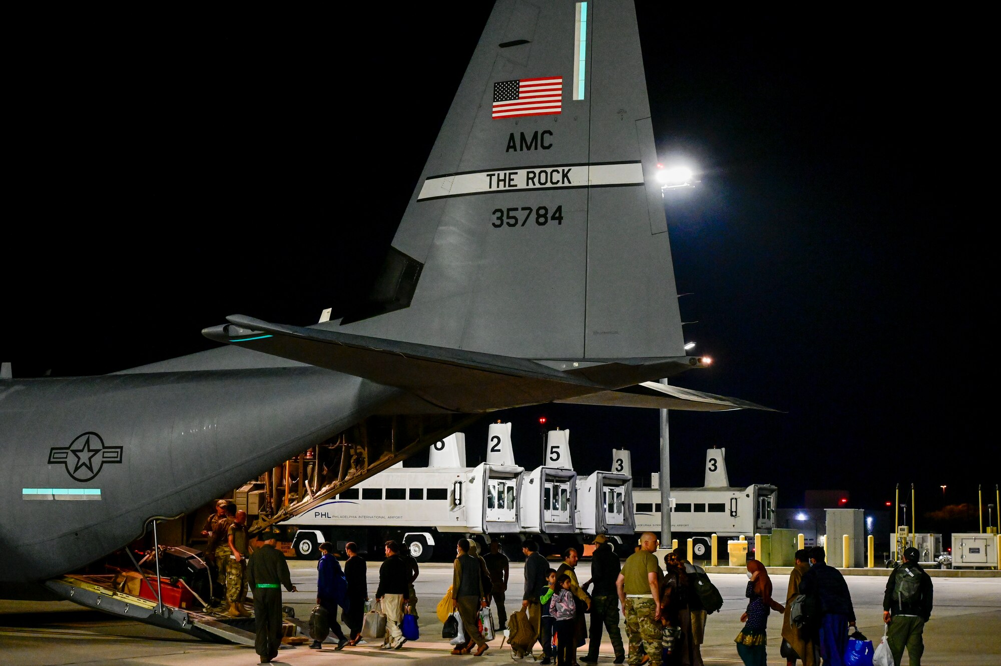 Afghan evacuees board a C-130J