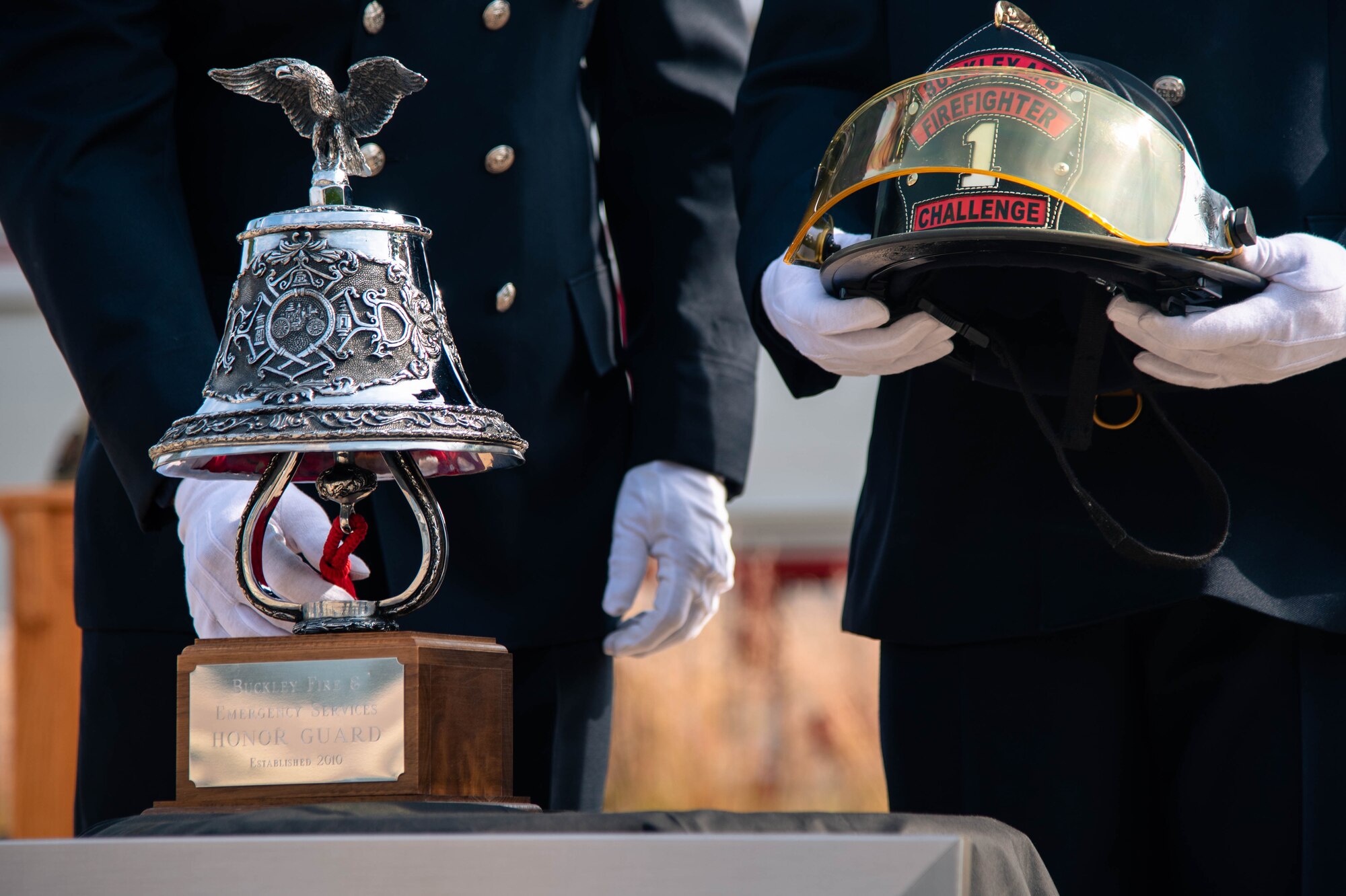 A Buckley Garrison Firefighter Honor Guardsman rings the bell during the Patriot Day Ceremony at Buckley Space Force Base, Colo., Sept. 10, 2021.