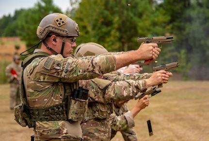 Staff Sgt. James Dansie, Utah National Guard, fires his pistol Sept. 2, 2021, during the General George Patton Combat Pistol match of the 50th Winston P. Wilson and the 30th Armed Forces Skill at Arms Championships, hosted by the National Guard Marksmanship Training Center, held at the Robinson Joint Maneuver Training Center, North Little Rock, Ark.