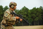 Army Sgt 1st. Class Michael Bautista, Idaho National Guard, examines his target during a rifle match Sept. 3, 2021, at the 30th Armed Forces Skill at Arms Meeting at the National Guard Marksmanship Training Center. Established in 1991, the Armed Forces Skills at Arms Meeting (AFSAM) is a multinational and interservice competition created to promote marksmanship training and competition between the different components and services of U.S. military forces and allied nations.