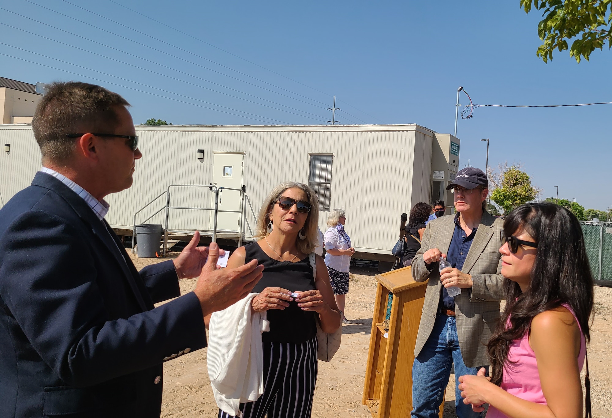 Dr. Kelly Hammett (left), director of the Air Force Research Laboratory Directed Energy Directorate speaks with Patricia Knighten, director of innovation at New Mexico State University Arrowhead; Dr. Nick Morley, AFRL senior scientist; and Xochitl Campos Biggs, district director for New Mexico U.S. Congresswoman Teresa Leger Fernandez, following the AFRL Wargaming and Advanced Research Simulation (WARS) Lab groundbreaking event held Sept. 8 at Kirtland AFB, N.M. (U.S. Air Force photo/Jeanne Dailey)