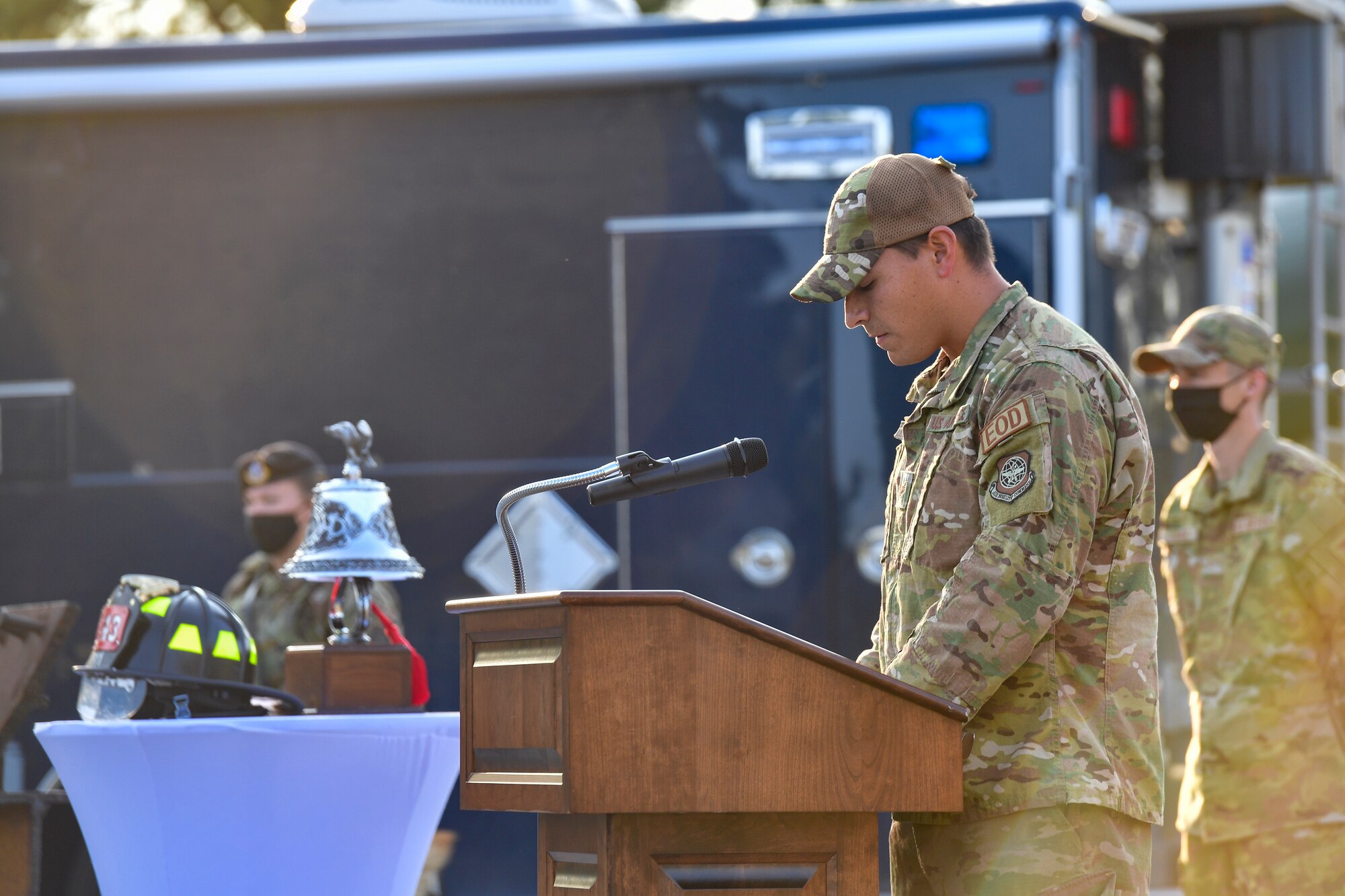 An Airman gives remarks during a ceremony
