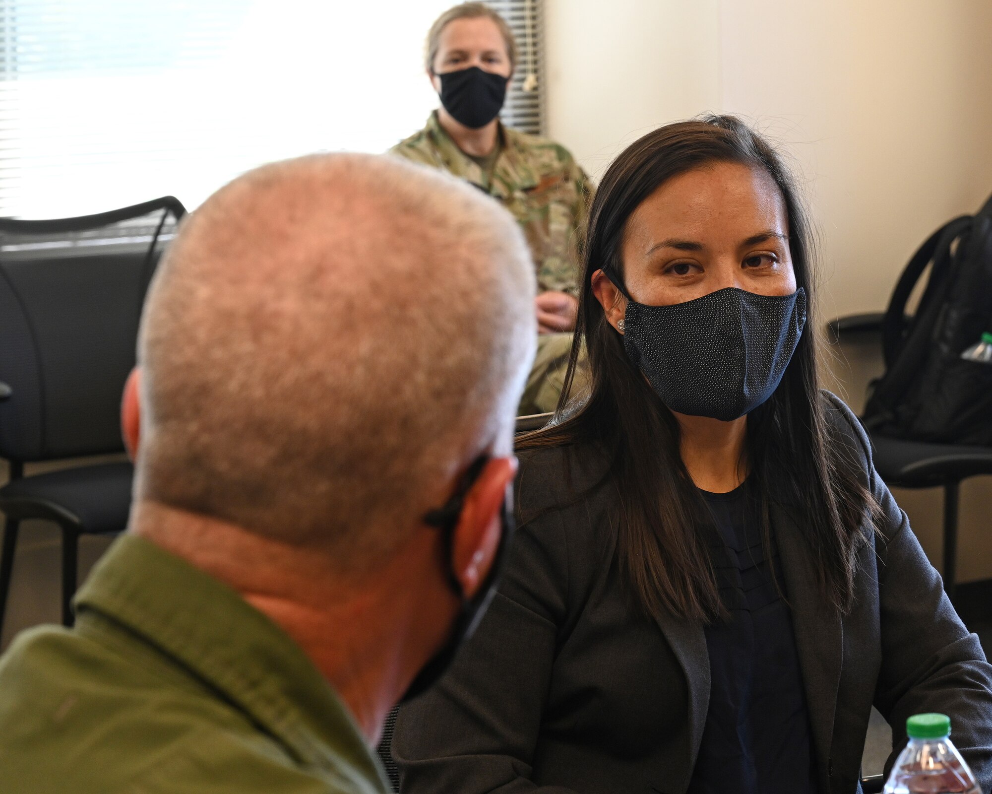 Undersecretary of the Air Force Gina Ortiz Jones speaks with U.S. Air Force Lt. Gen. Michael A. Loh (center), director of the Air National Guard, and U.S. Air Force Brig. Gen. Paul Johnson (right), 175th Wing commander, at Warfield Air National Guard Base at Martin State Airport, Middle River, Md., September 11, 2021. The visit from the Honorable Gina Ortiz Jones is the first to the Maryland Air National Guard during her tenure as the Undersecretary of the Air Force. (U.S. Air National Guard photo by Master Sgt. Christopher Schepers)