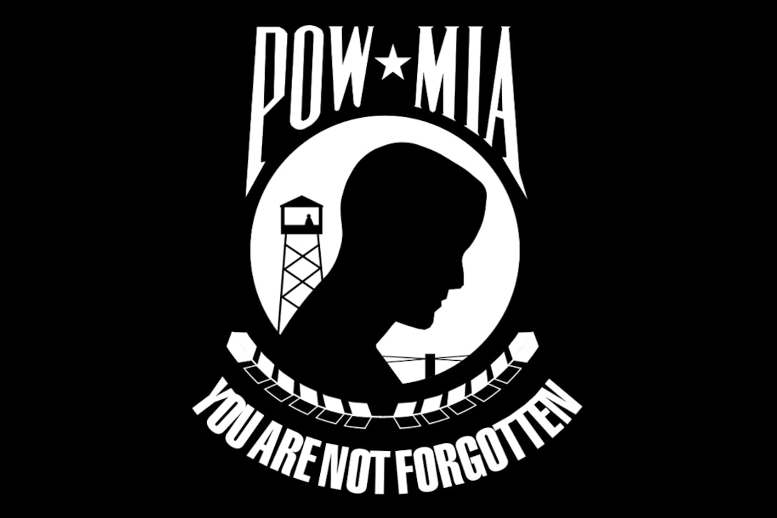 A black flag with a whiteinsignis and lettering reminds all POWs/MIAs “You are not forgotten.”