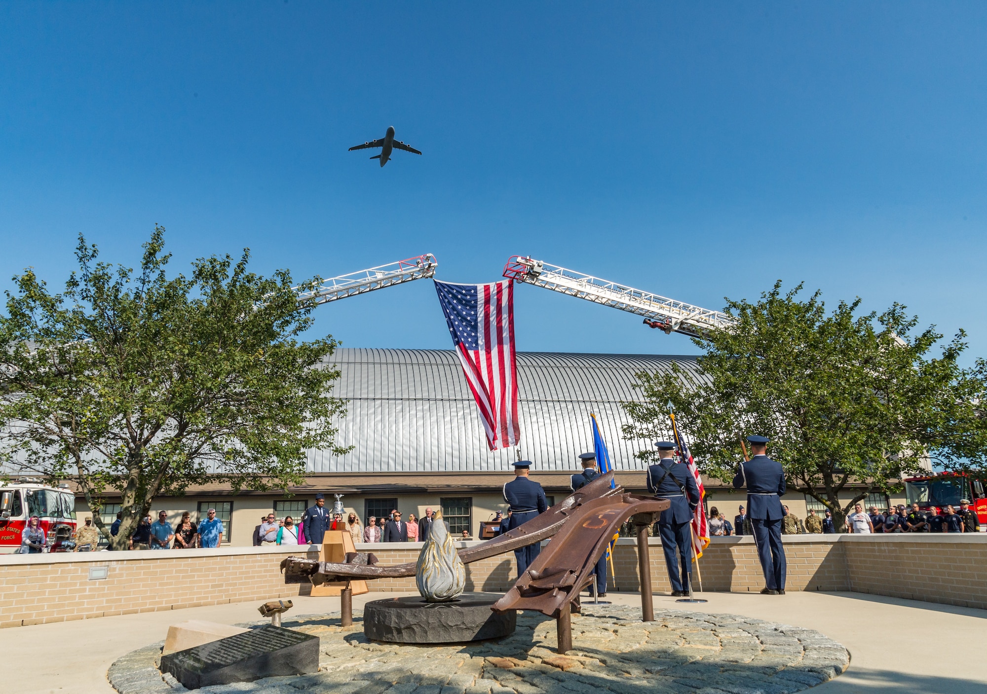 A C-5M Super Galaxy flies over the Air Mobility Command Museum during the 9/11 Remembrance Ceremony on Dover Air Force Base, Delaware, Sept. 11, 2021. The base commemorated  the 20th Anniversary of 9/11 to remember and honor those who perished in the attacks on Sept. 11, 2001. (U.S. Air Force photo by Roland Balik)