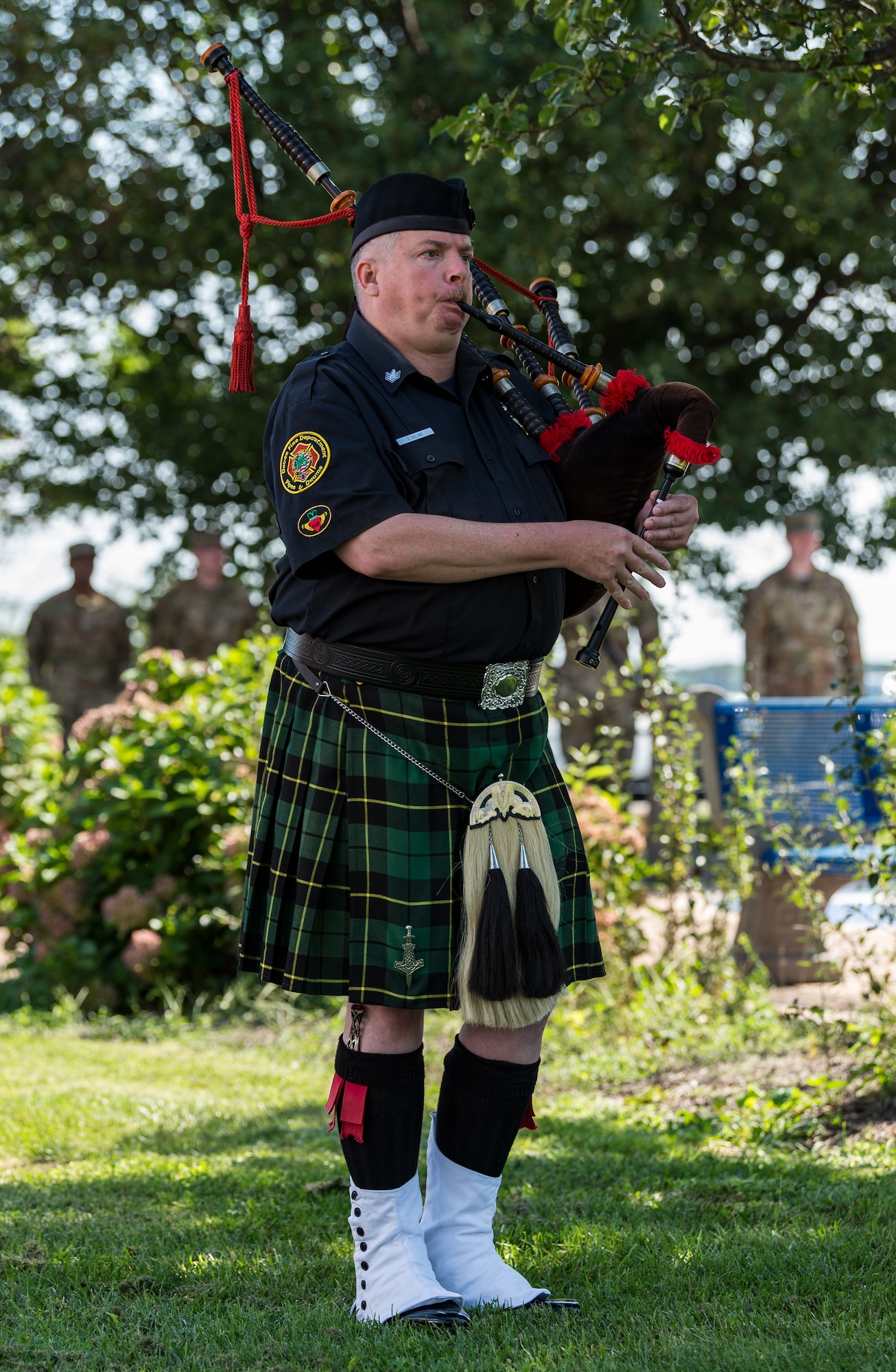 Timothy Kline, Dover Fire Pipes and Drums Corps, plays Amazing Grace at the conclusion of the 20th Anniversary 9/11 Remembrance Ceremony held at the Air Mobility Command Museum's 9/11 Memorial on Dover Air Force Base, Delaware, Sept. 11, 2021. The base hosted the ceremony to remember and honor those who perished in the attacks on Sept. 11, 2001. (U.S. Air Force photo by Roland Balik)