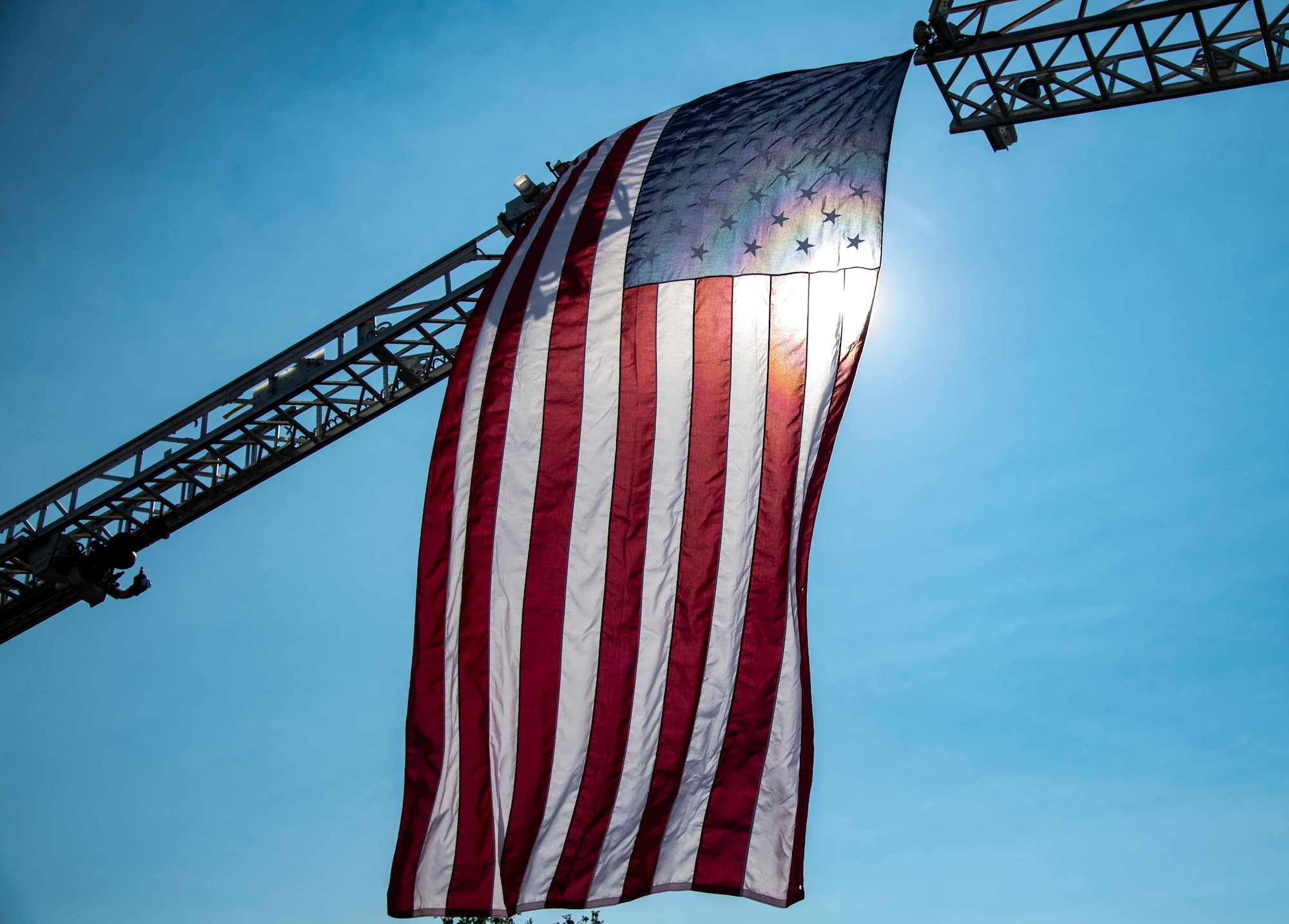 An American flag waves during the 20th Anniversary 9/11 Remembrance Ceremony held at the Air Mobility Command Museum’s 9/11 Memorial on Dover Air Force Base, Delaware, Sept. 11, 2021. The base hosted the ceremony to remember and honor those who perished in the attacks on Sept. 11, 2001. (U.S. Air Force photo by Senior Airman Stephani Barge)