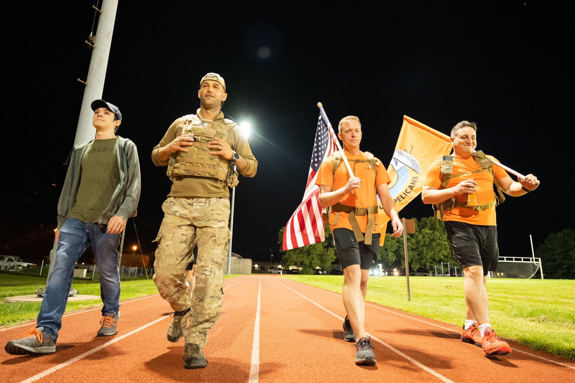 Team Dover members participate in the 9/11 Remembrance Ruck March on Dover Air Force Base, Delaware, Sept. 10, 2021. Units from Team Dover rucked in 30-minute increments for more than 25 hours, remembering and honoring those who perished in the attacks on Sept. 11, 2001. (U.S. Air Force photo by Mauricio Campino)