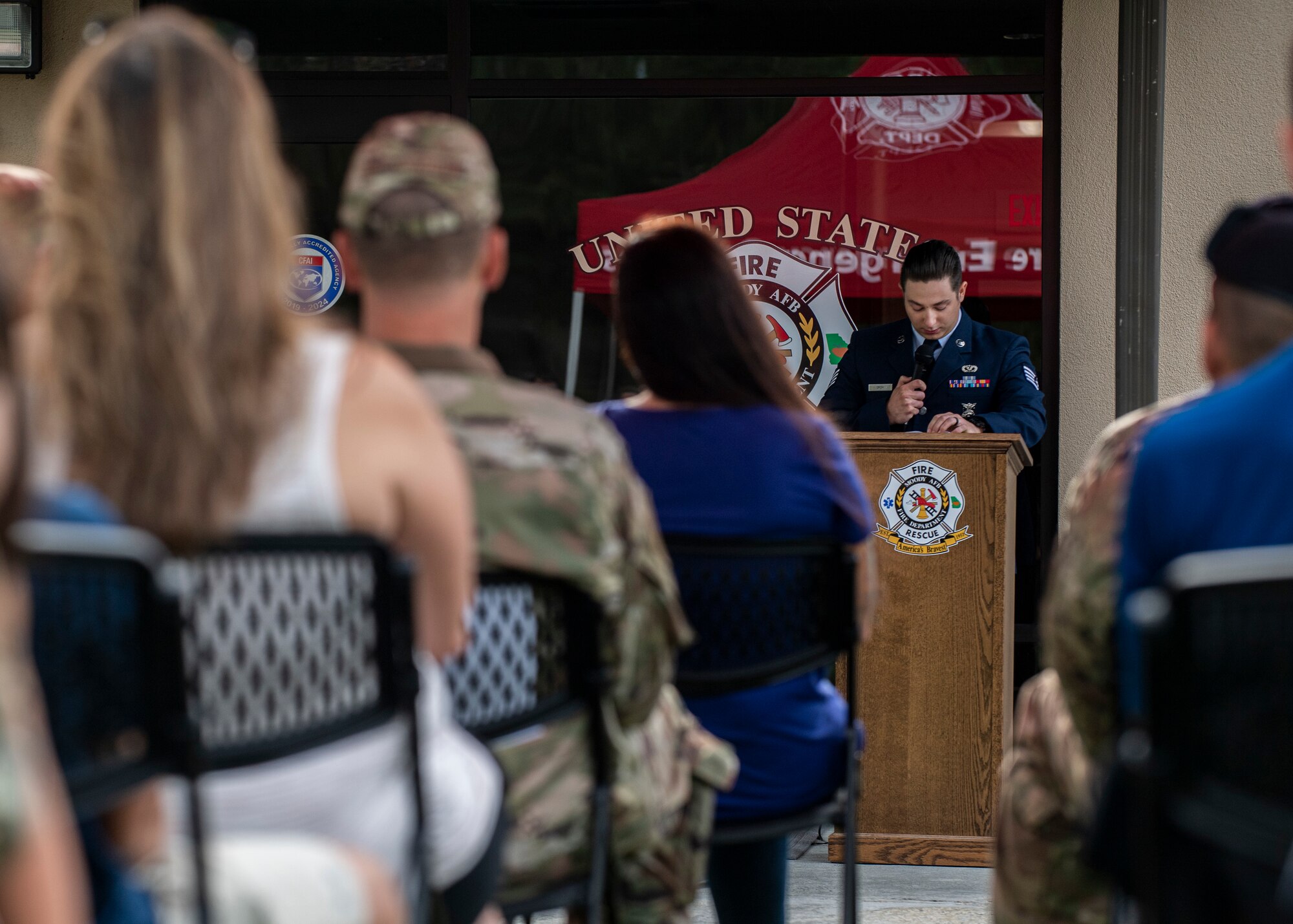 An Airman reads a script