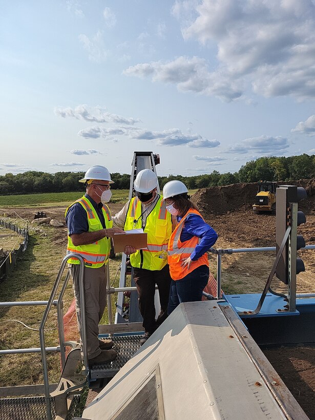 Iowa Army Ammunition Plant (IAAAP) project manager Mike Kessler explains the soil-sorting process to the director of the Department of Energy’s Office of Legacy Management, Carmelo Melendez, and his associate, Gwen Hooten, at IAAAP in Middleton, Iowa, Sept. 9. Hooten is DOE-LM’s CERCLA/RCRA/FUSRAP team lead. The Comprehensive Environmental Response, Compensation and Liability Act (CERCLA) is the law that governs FUSRAP. The Resource Conservation and Recovery Act (RCRA) governs solid-waste and hazardous-waste transportation, treatment, storage and disposal.