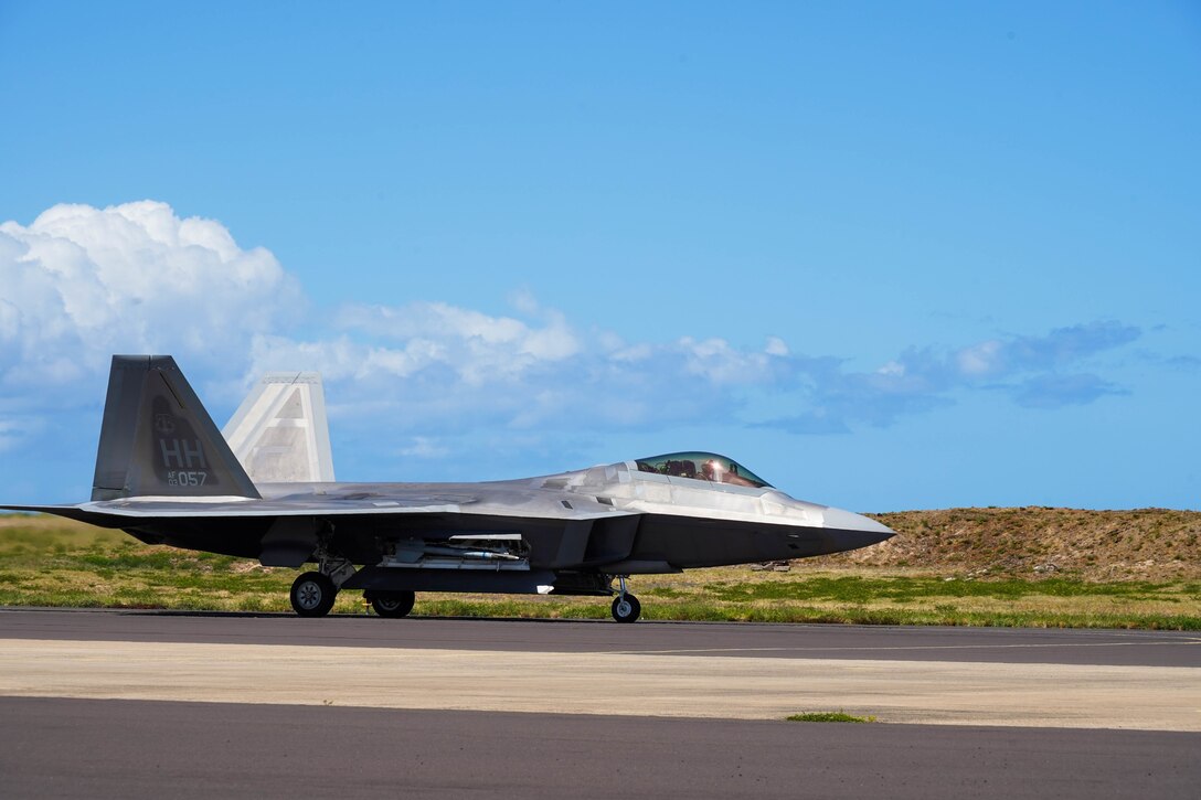 An F-22 Hawaiian Raptor lands during an Agile Combat Employment training exercise at Pacific Missile Range Facility Barking Sands, Hawaii, September 8, 2021.  The ACE concept utilizes Multi-Capable Airmen to refuel, rearm, and perform maintenance to fighter jets ensuring the aircraft are ready to rapidly deploy. (U.S. Air Force photo by Airman 1st Class Makensie Cooper)