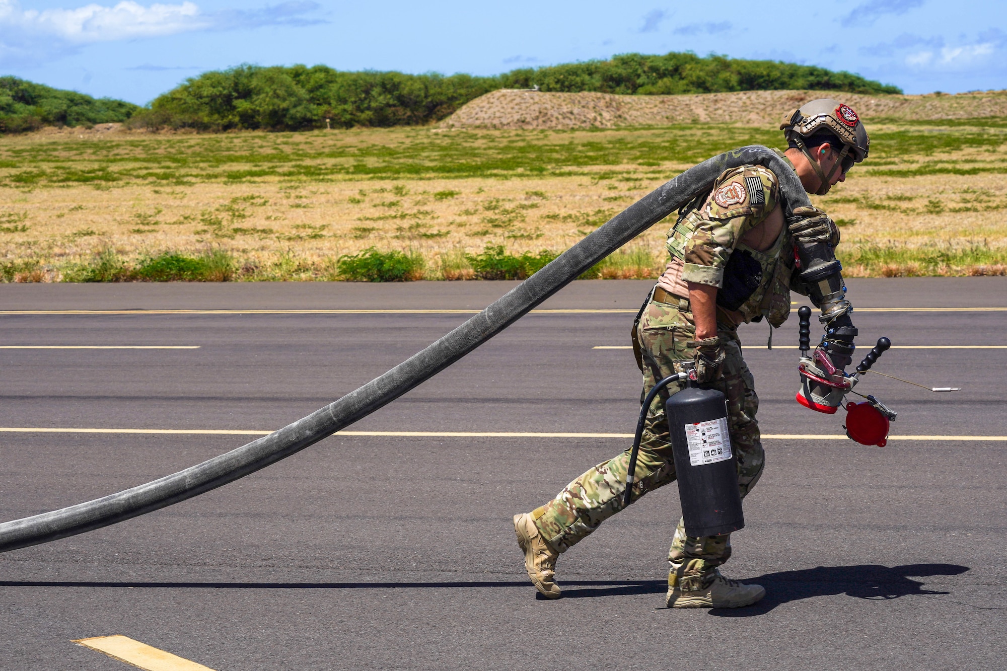 Staff Sgt. Andrew Lozoya, 353d Special Operations Group, forward area refueling point team member, conducts static forward area refueling point training during an Agile Combat Employment training exercise at Pacific Missile Range Facility Barking Sands, Hawaii, September 8, 2021. During the exercise, Airmen from the 15th Wing and Hawaiian Air National Guard worked alongside the 353d SOG and were able to refuel F-22 Hawaiian Raptors from a MC-130J Commando II ensuring the fighter was ready to rapidly deploy. (U.S. Air Force photo by Airman 1st Class Makensie Cooper)