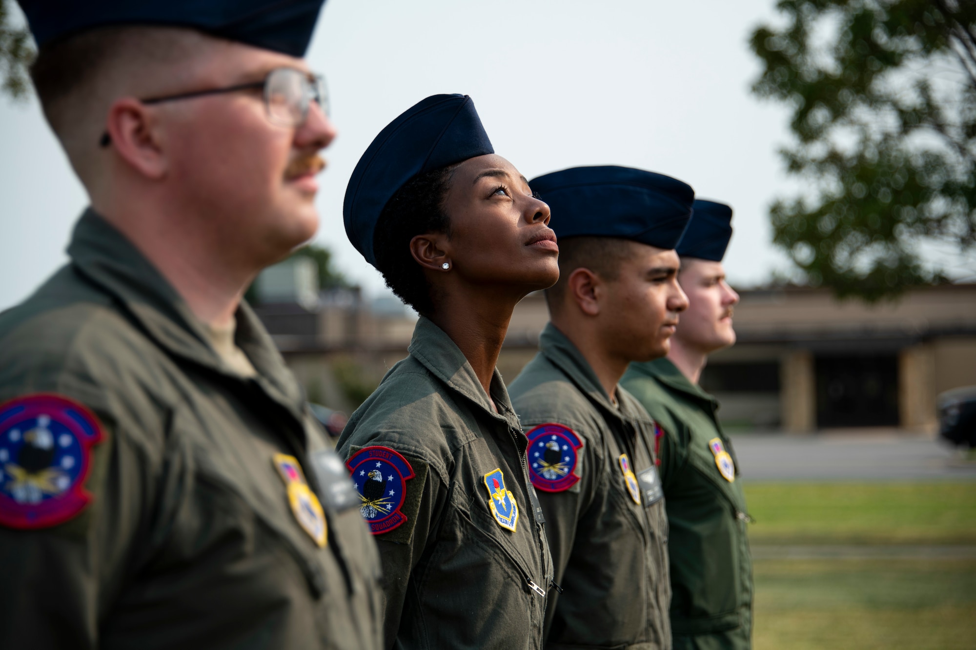97th Training Squadron students stand at ease during a 9/11 remembrance ceremony at Altus Air Force Base, Oklahoma, Sept. 10, 2021. The ceremony was a precursor to the 97th Air Mobility Wing Remembrance Ceremony and was held to educate generations of younger Airmen on the significance of 9/11. (U.S. Air Force photo by Senior Airman Amanda Lovelace)