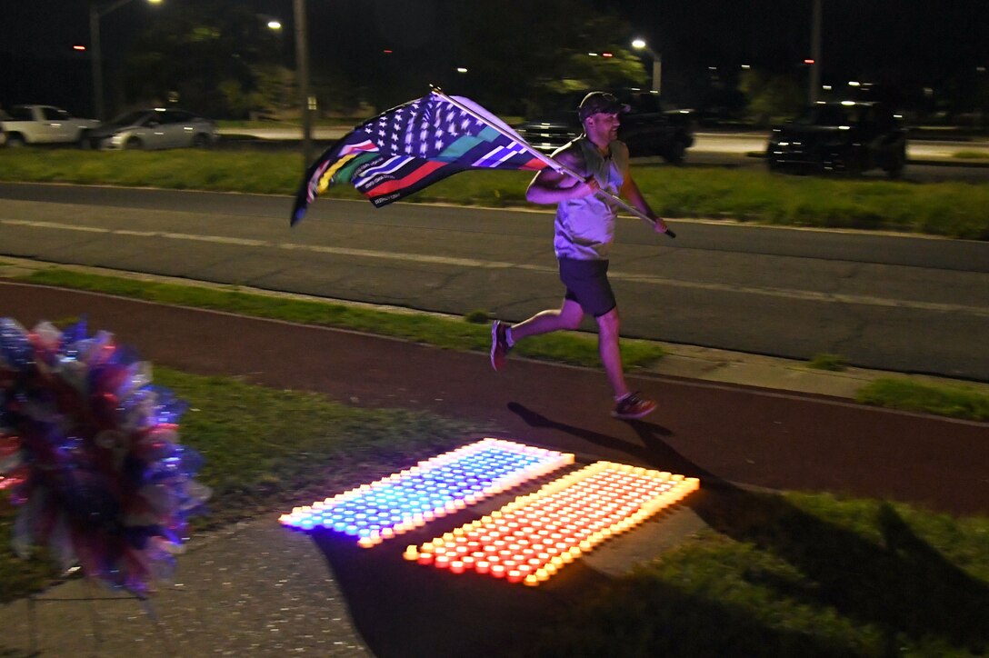 U.S. Air Force Capt. Brian Chapman, 81st Healthcare Operations Squadron internal medicine resident, participates in the 2nd Annual 9/11 Memorial Run at Keesler Air Force Base, Mississippi, Sept. 10, 2021. The 24-hour run honored those who lost their lives during the 9/11 attacks. (U.S. Air Force photo by Kemberly Groue)