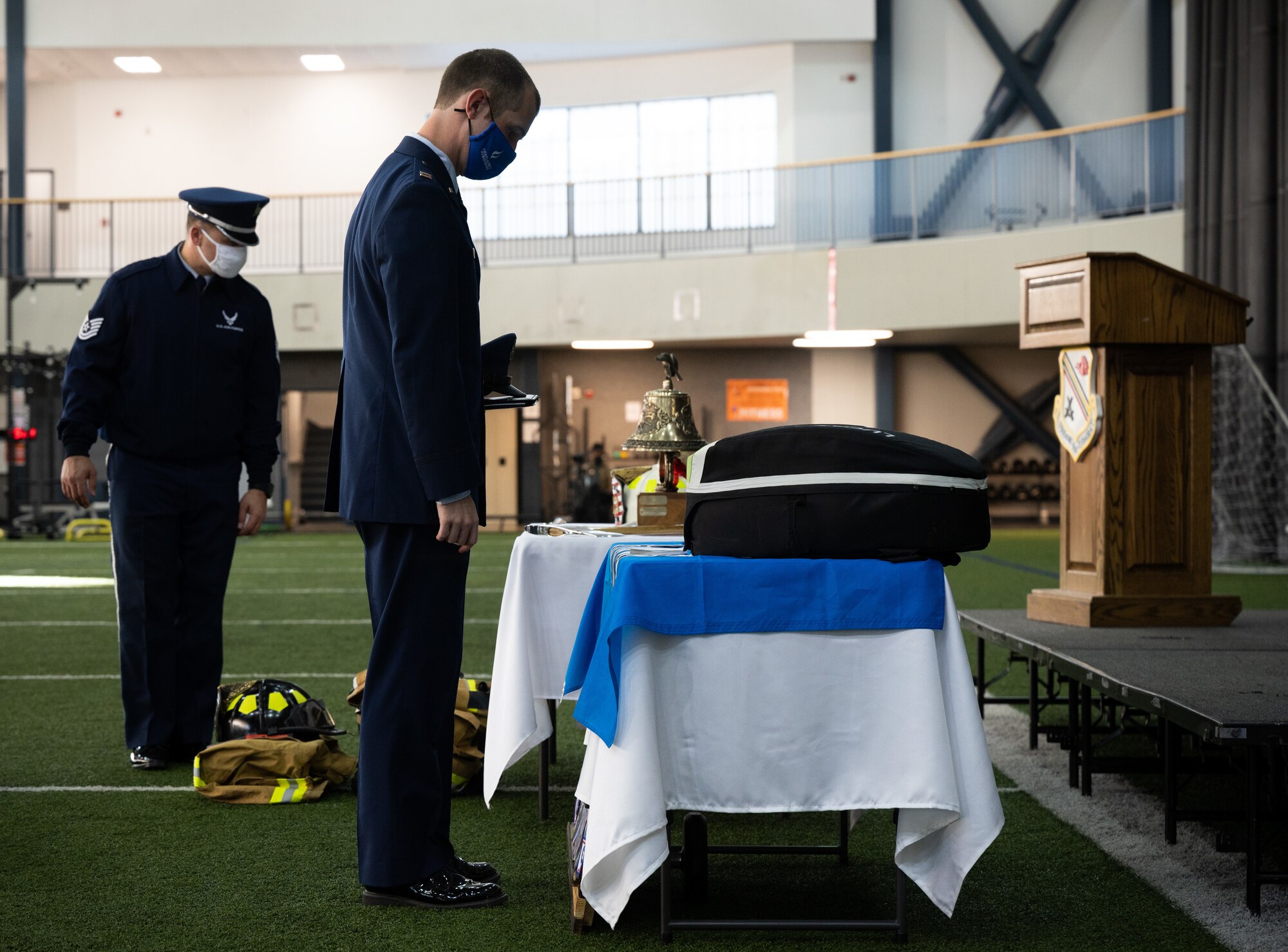 U.S. Air Force Airmen from the 354th Fighter Wing look at 9/11 memorabilia during a remembrance ceremony on Eielson Air Force Base, Alaska, Sept. 11, 2021.