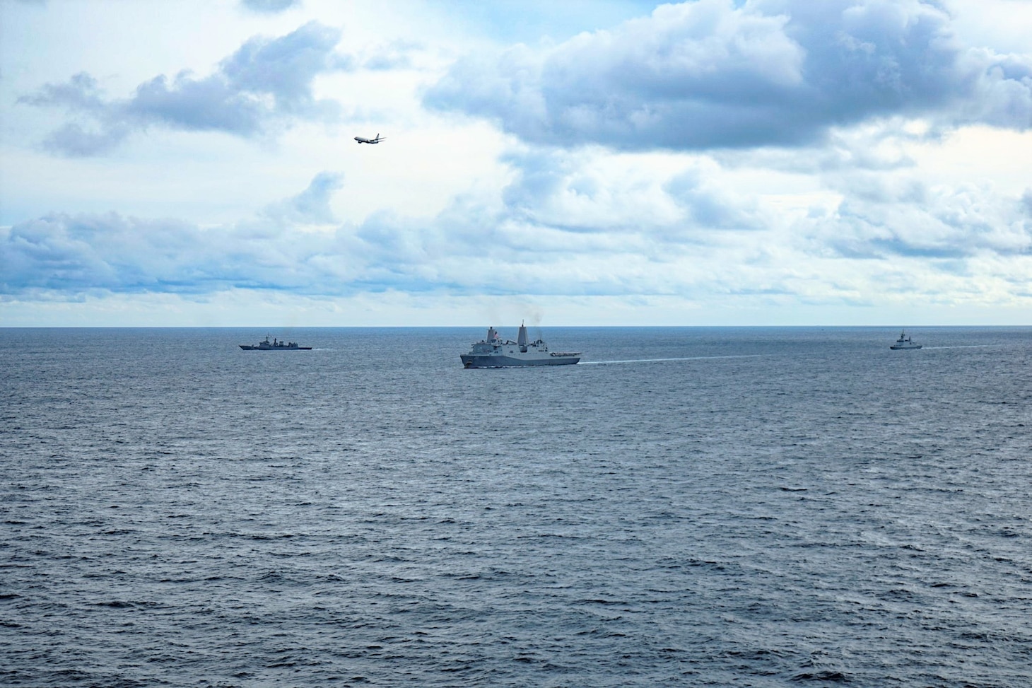 GULF OF THAILAND (Sept. 8, 2021) USS Green Bay (LPD 20) sails in company with Royal Navy Thai frigates as a U.S Navy P-8 from Commander, Task Force 72 flies overhead during Cooperation Afloat Readiness and Training (CARAT) exercise. In its 27th year, the CARAT series is comprised of multinational exercises designed to enhance U.S. and partner navies' abilities to operate together in response to traditional and non-traditional maritime security challenges in the Indo-Pacific region. (Courtesy photo by Royal Thai Navy)