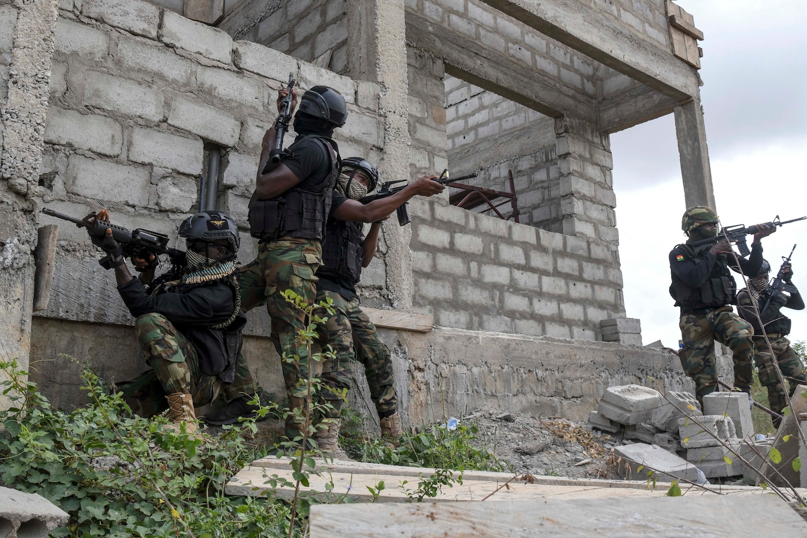 Special operators conduct an exercise in an old building.