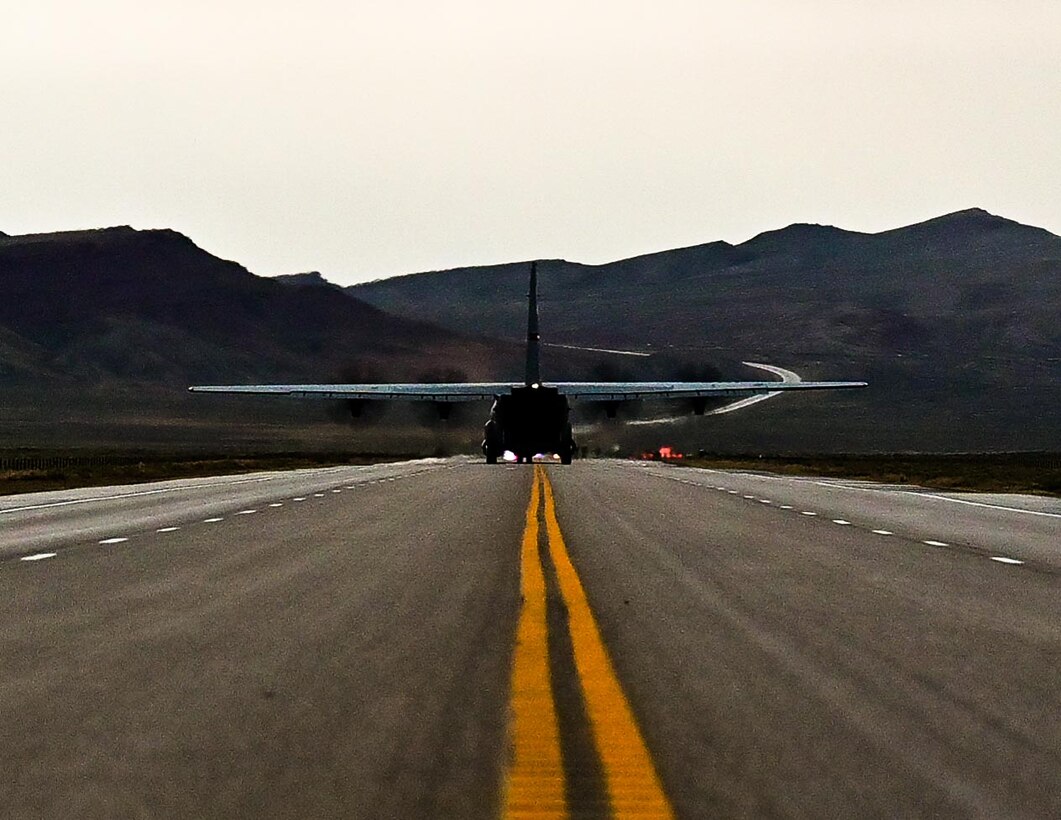 Cargo aircraft lifting off of a highway