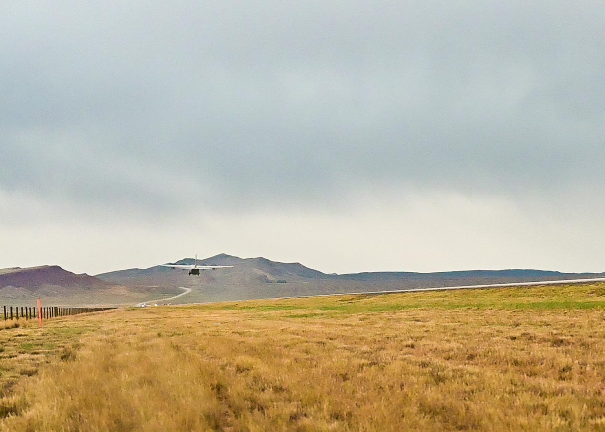 Cargo aircraft lifting off of a highway