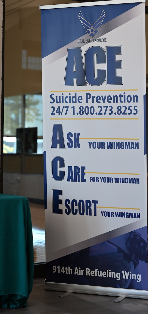 A tall banner reads “Ask, Care, Escort.”