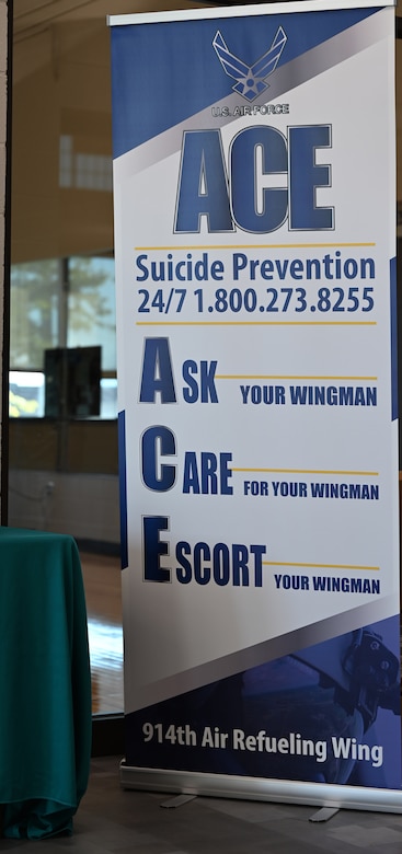 A tall banner reads “Ask, Care, Escort.”