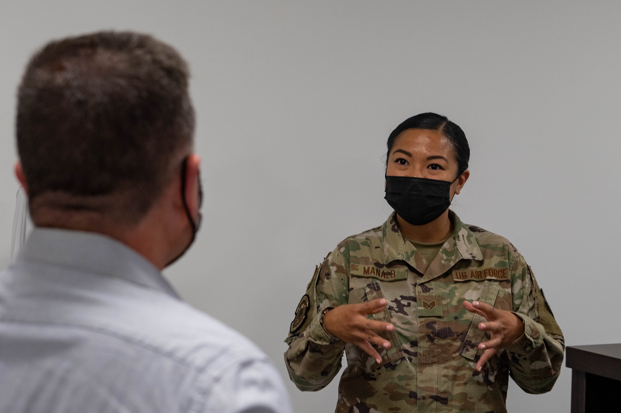 Col Gingrich speaking with Airman at 717th ABS