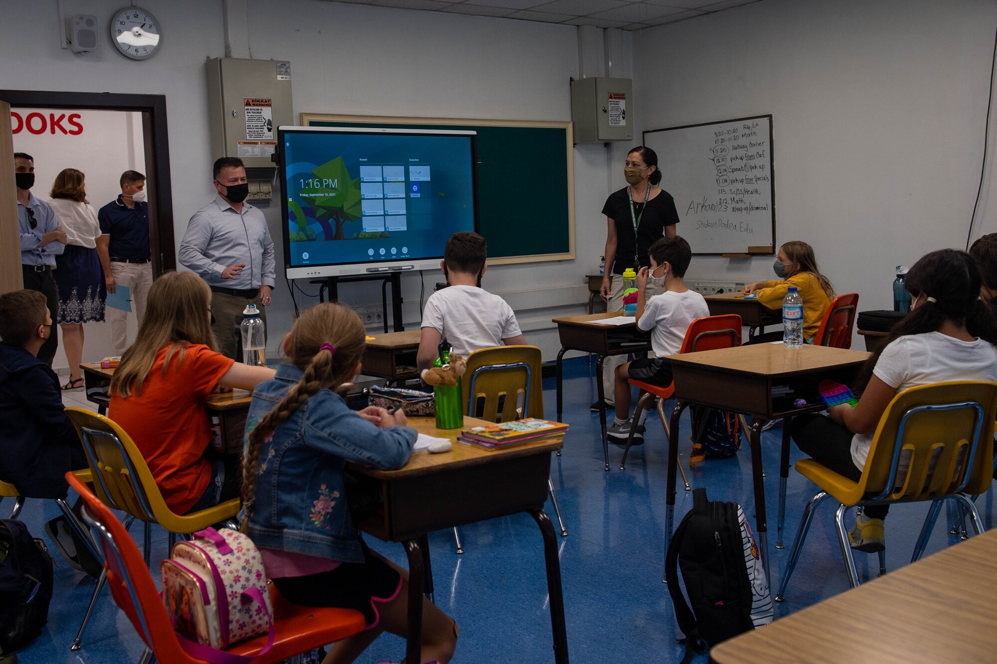 Air Force officer meeting classroom of students at a DOD facility
