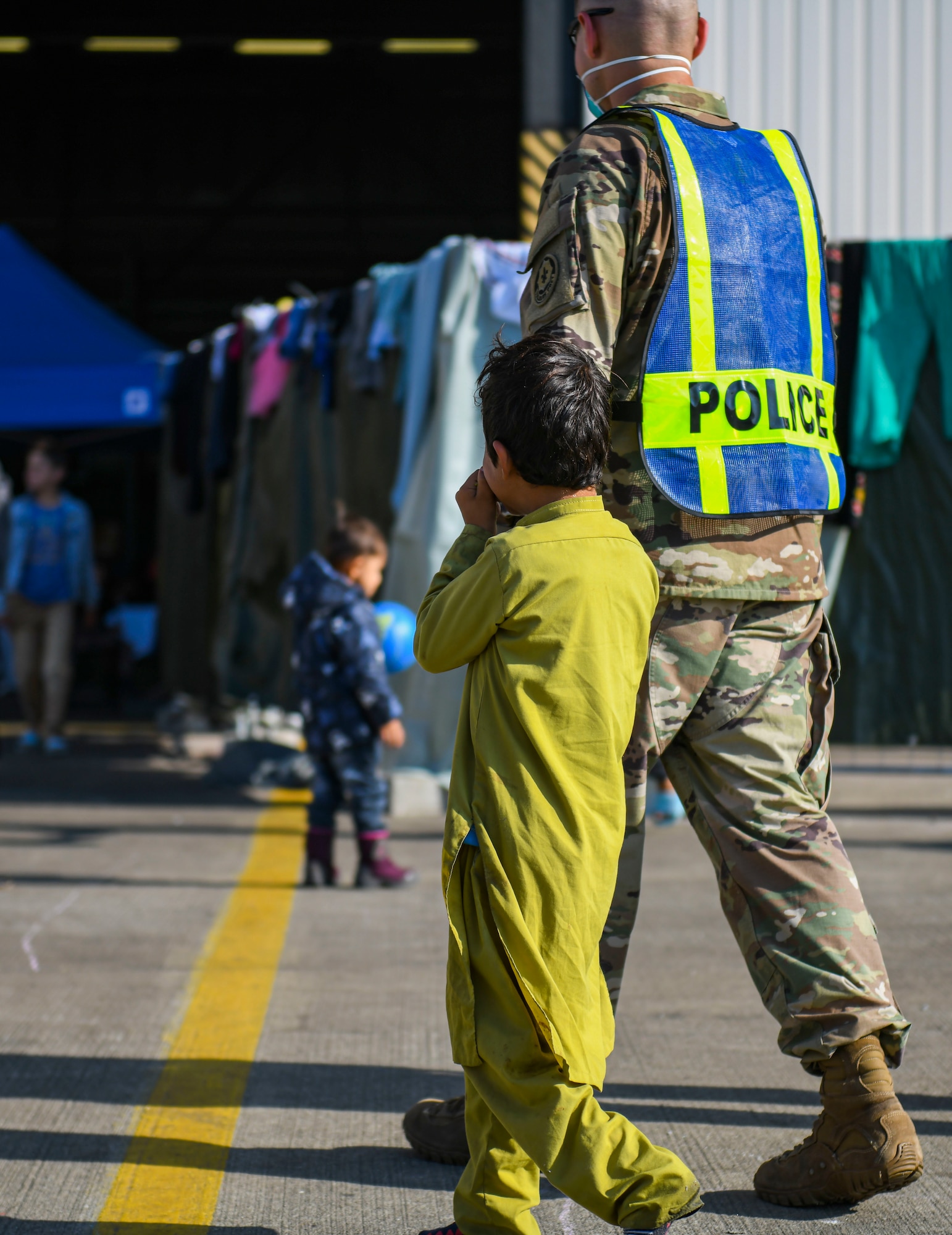 Volunteer holds hand with evacuee.
