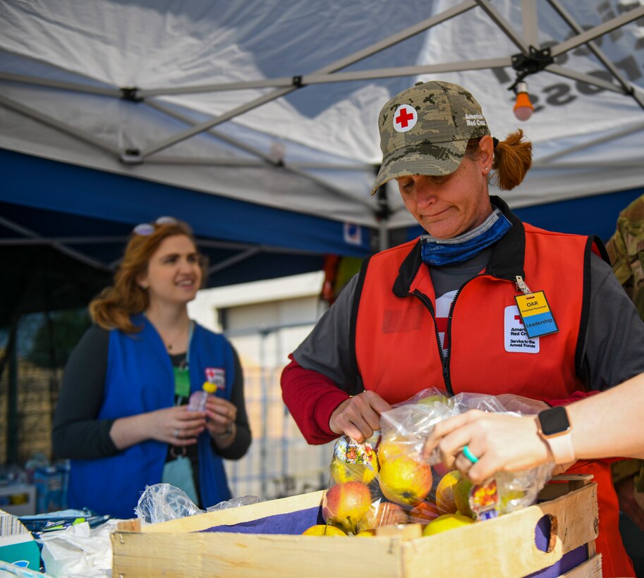 Volunteers sorting through food donations.