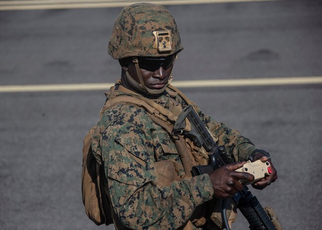 Pfc. Guerby Destine, 22, number two cannoneer with 1st Battalion, 12th Marines and a Westbury, New York, native, drives the teleoperated Navy/Marine Corps Expeditionary Ship Interdiction System launcher, Remotely-Operated Ground Unit for Expeditionary Fires, aboard Pacific Missile Range Facility Barking Sands, Hawaii, Aug. 15, 2021. The Marines of 1/12 struck a naval target ship with two Naval Strike Missiles after sensing and targeting the vessel from their fires expeditionary advanced base while participating in Large Scale Exercise 2021. The Marine Corps’ primary modernization priority in support of Force Design 2030 is fulfilling the requirement for a ground-based anti-ship missile capability. NMESIS is the Marine Corps’ first solution meeting this requirement. (U.S. Marine Corps photo by Cpl. Luke Cohen, released)