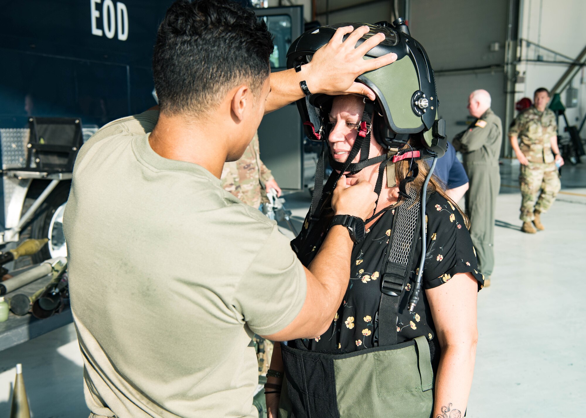Sara McFall, ESGR employer, puts on an EOD suit at Grissom Air Reserve Base, Indiana, Aug. 27, 2021. Employers of the ESGR were nominated directly by their service member to attend this boss lift event. (U.S. Air Force photo by Staff Sgt. Jeremy Blocker)