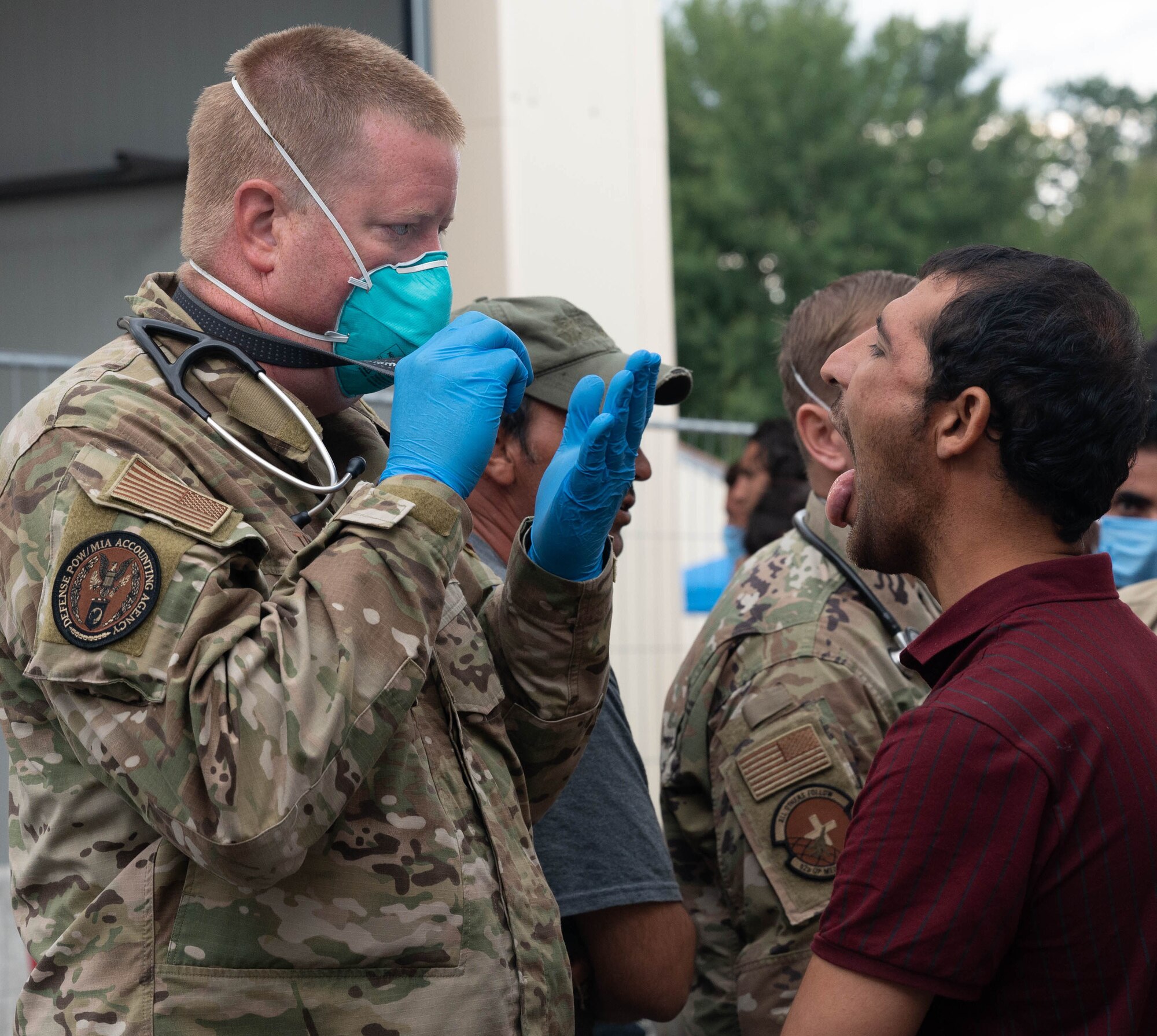 Airman performs medical exam.